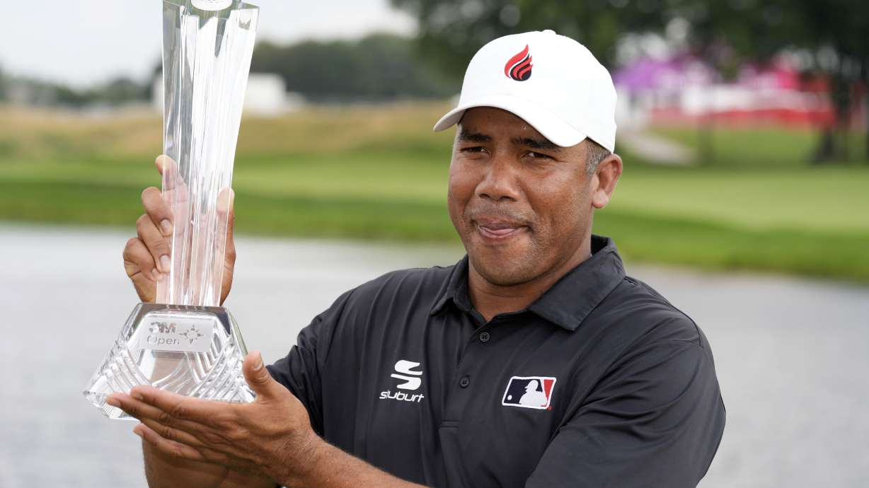 Jhonattan Vegas holds the trophy after winning the 3M Open golf tournament at the Tournament Players Club, Sunday, July 28, 2024, in Blaine, Minn.