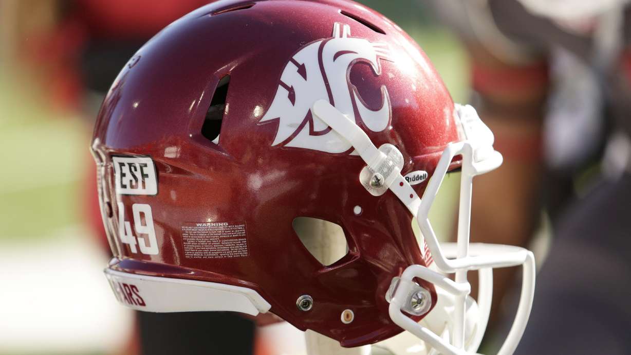 A Washington State helmet sits on a stand before an NCAA college football game, Saturday, Nov. 7, 2015, in Pullman, Wash.