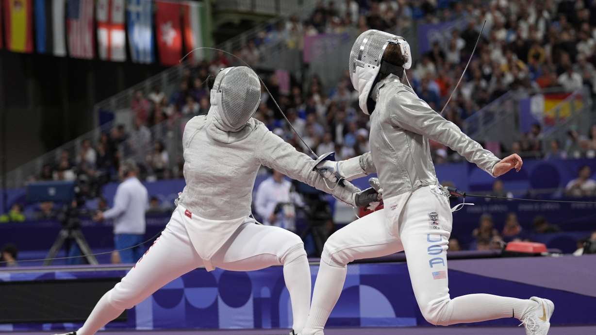 South Korea's Choi Sebin, left, and United States' Tatiana Nazlymov compete in the women's individual Sabre round of 32 competition during the 2024 Summer Olympics at the Grand Palais, Monday, July 29, 2024, in Paris, France.