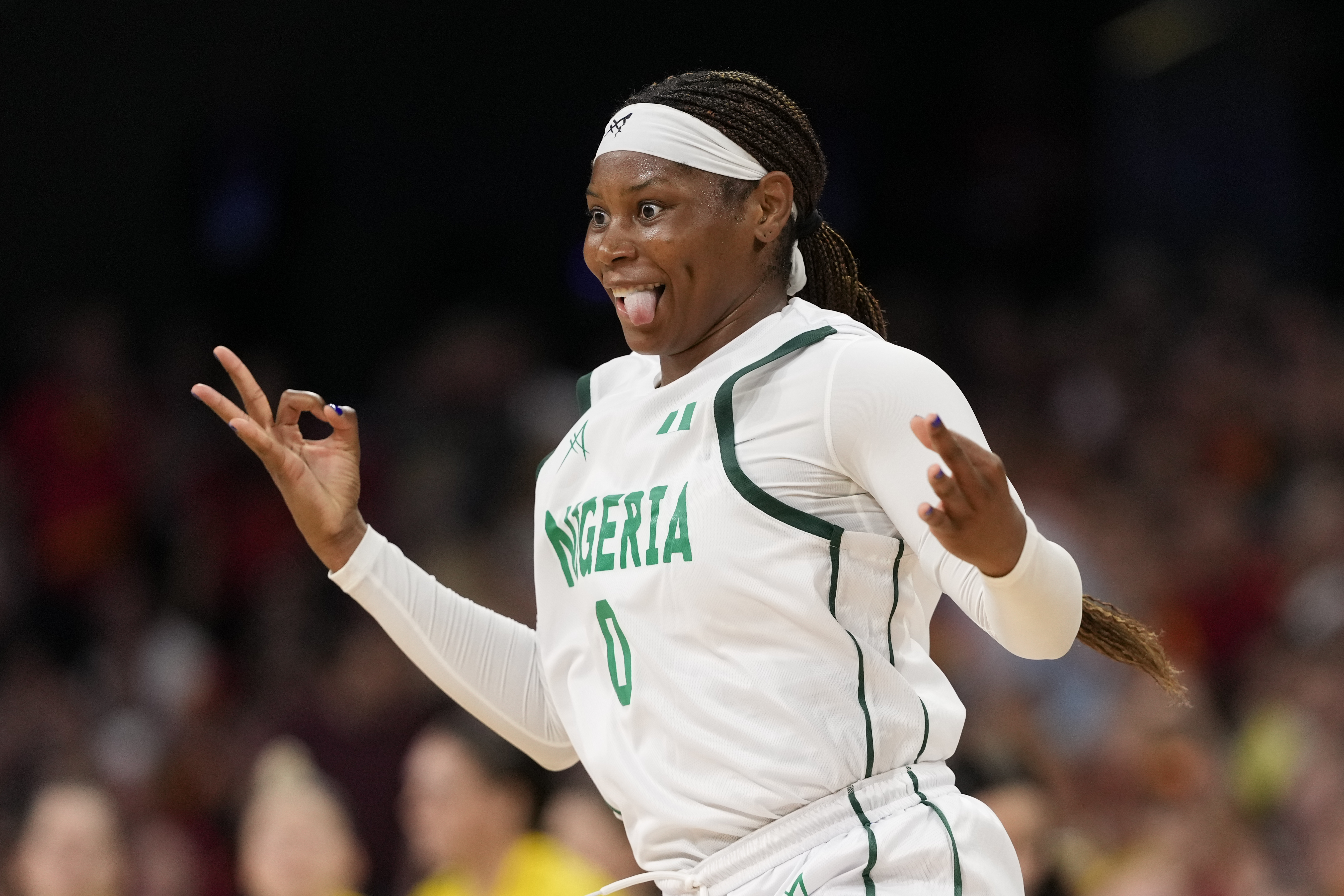 Amy Okonkwo, of Nigeria, celebrates after a three-point shot against Australia in a women's basketball game at the 2024 Summer Olympics, Monday, July 29, 2024, in Villeneuve-d'Ascq, France. 