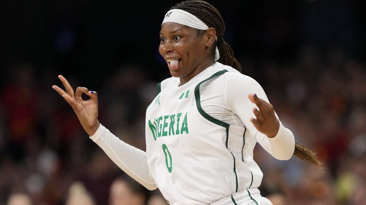 Amy Okonkwo, of Nigeria, celebrates after a three-point shot against Australia in a women's basketball game at the 2024 Summer Olympics, Monday, July 29, 2024, in Villeneuve-d'Ascq, France.