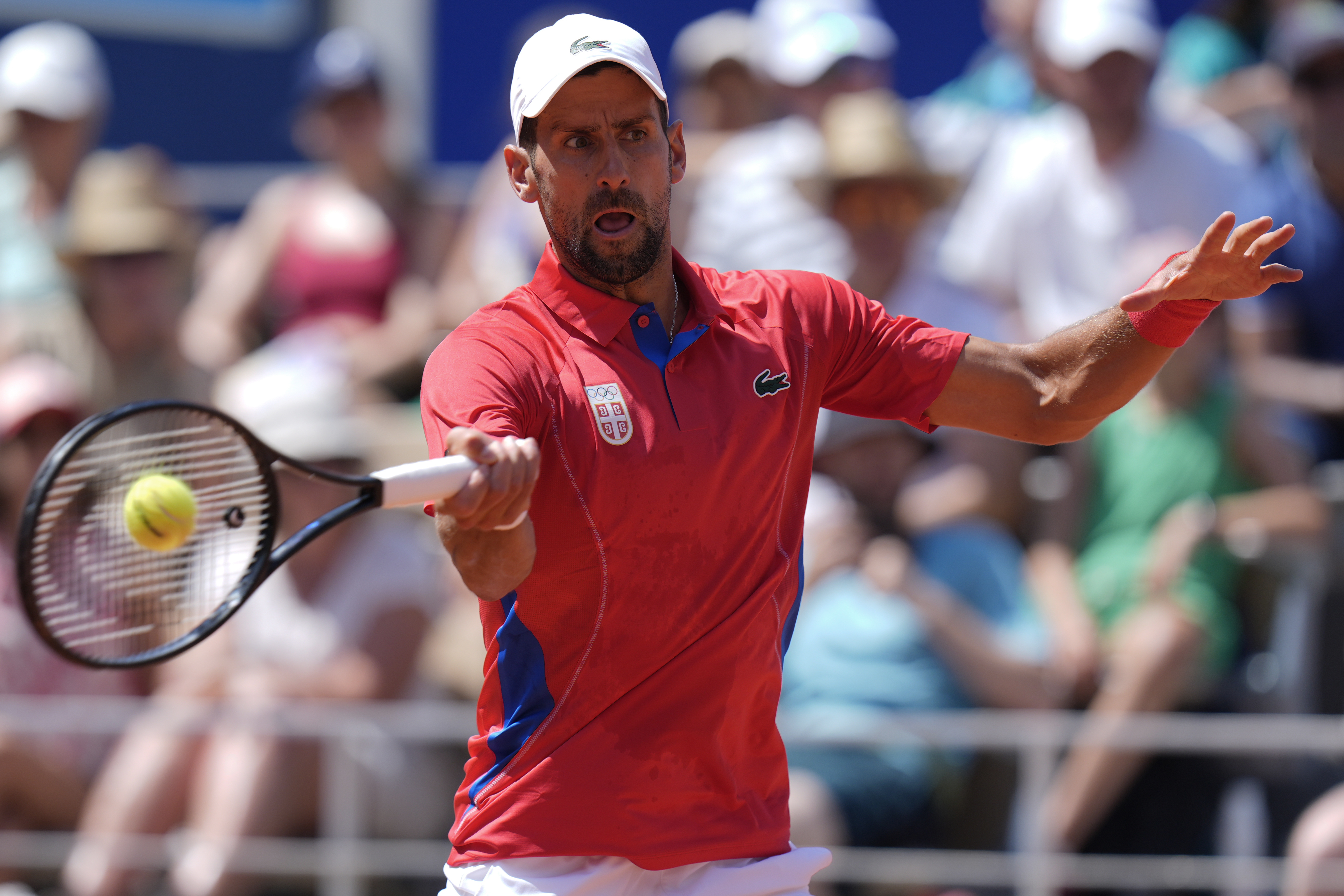 Serbia's Novak Djokovic returns the ball to Spain's Rafael Nadal during their men's singles second round match at the 2024 Summer Olympics, Monday, July 29, 2024, at the Roland Garros stadium in Paris, France. 