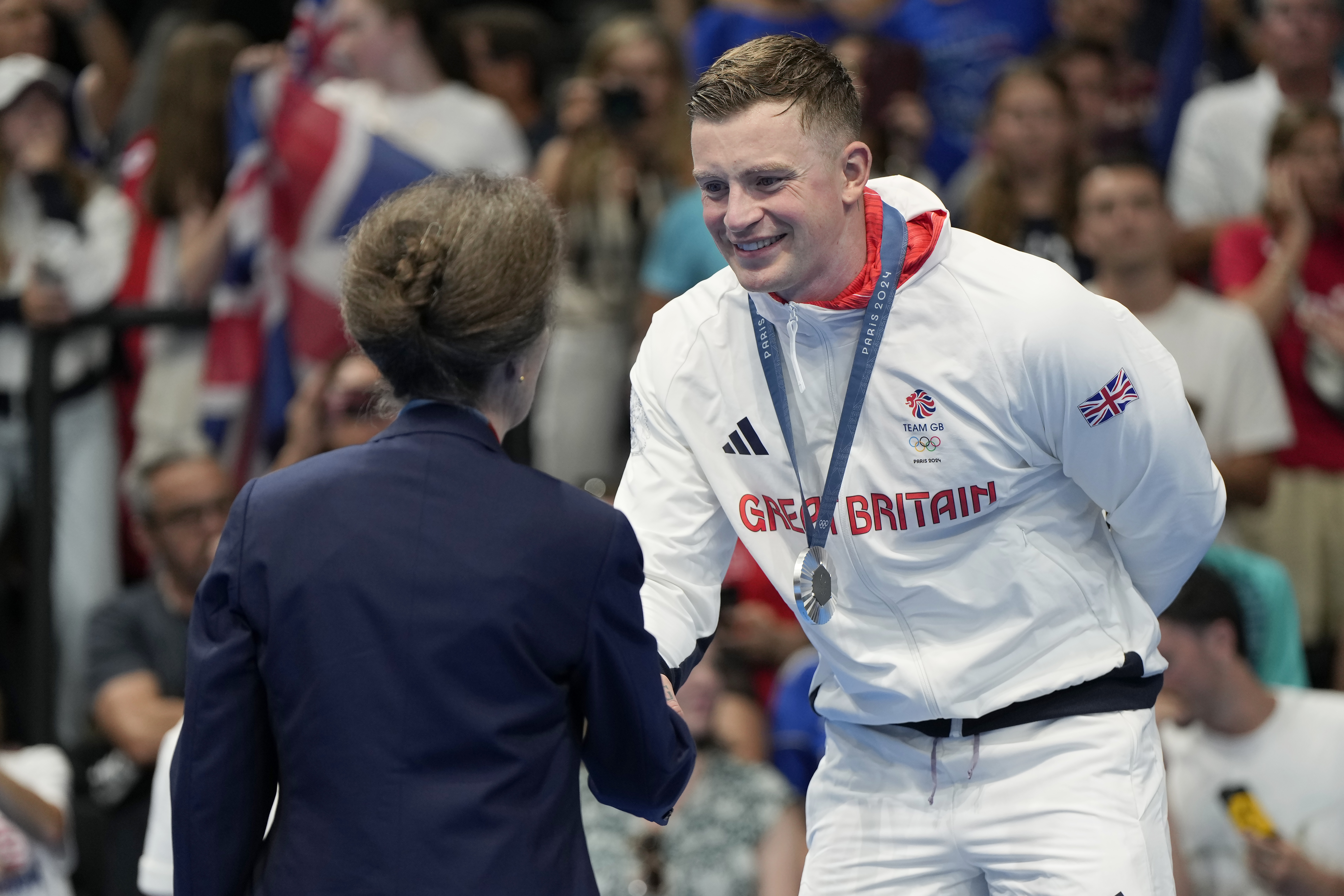 Britain's Princess Anne, left, congratulates Adam Peaty, of Britain, after winning the silver medal in the men's 100-meter breaststroke final at the 2024 Summer Olympics, Sunday, July 28, 2024, in Nanterre, France. 