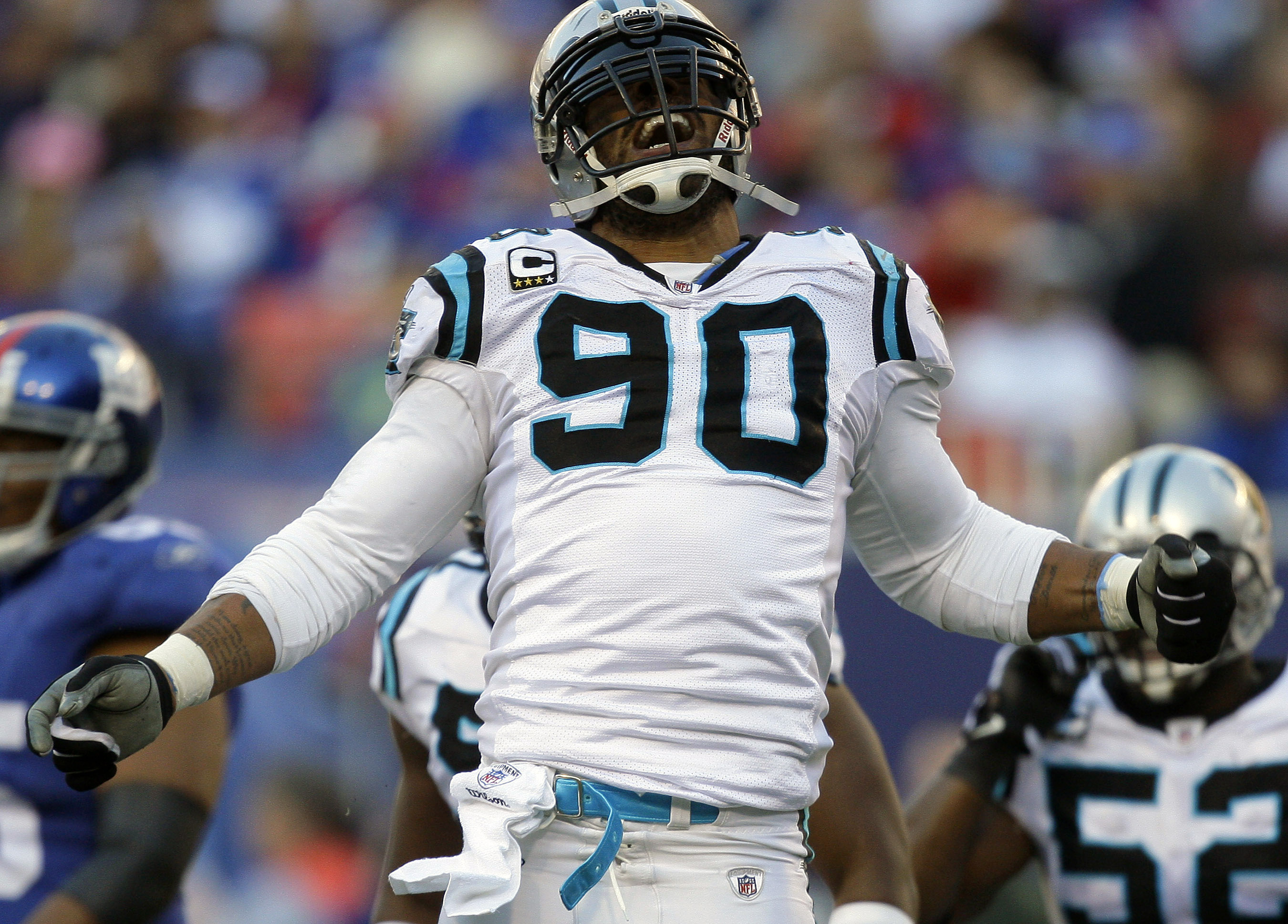 FILE - Carolina Panthers defensive end Julius Peppers  reacts after sacking New York Giants quarterback Eli Manning in the second quarter of an NFL football game Sunday, Dec. 27, 2009, in East Rutherford, N.J. Peppers, who was a member two NFL All-Decade teams and had 159 1/2 sacks during his 17-year NFL career, will be enshrined into the Pro Football Hall of Fame on Aug. 3, 2024, in Canton, Ohio. (AP Photo/Julie Jacobson, File0