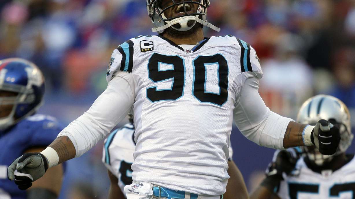 FILE - Carolina Panthers defensive end Julius Peppers reacts after sacking New York Giants quarterback Eli Manning in the second quarter of an NFL football game Sunday, Dec. 27, 2009, in East Rutherford, N.J. Peppers, who was a member two NFL All-Decade teams and had 159 1/2 sacks during his 17-year NFL career, will be enshrined into the Pro Football Hall of Fame on Aug. 3, 2024, in Canton, Ohio. (AP Photo/Julie Jacobson, File0
