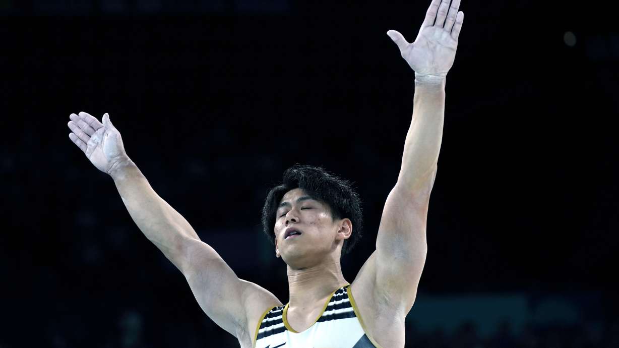 Daiki Hashimoto, of Japan, celebrates after performing on the pommel horse during the men's artistic gymnastics team finals round at Bercy Arena at the 2024 Summer Olympics, Monday, July 29, 2024, in Paris, France.