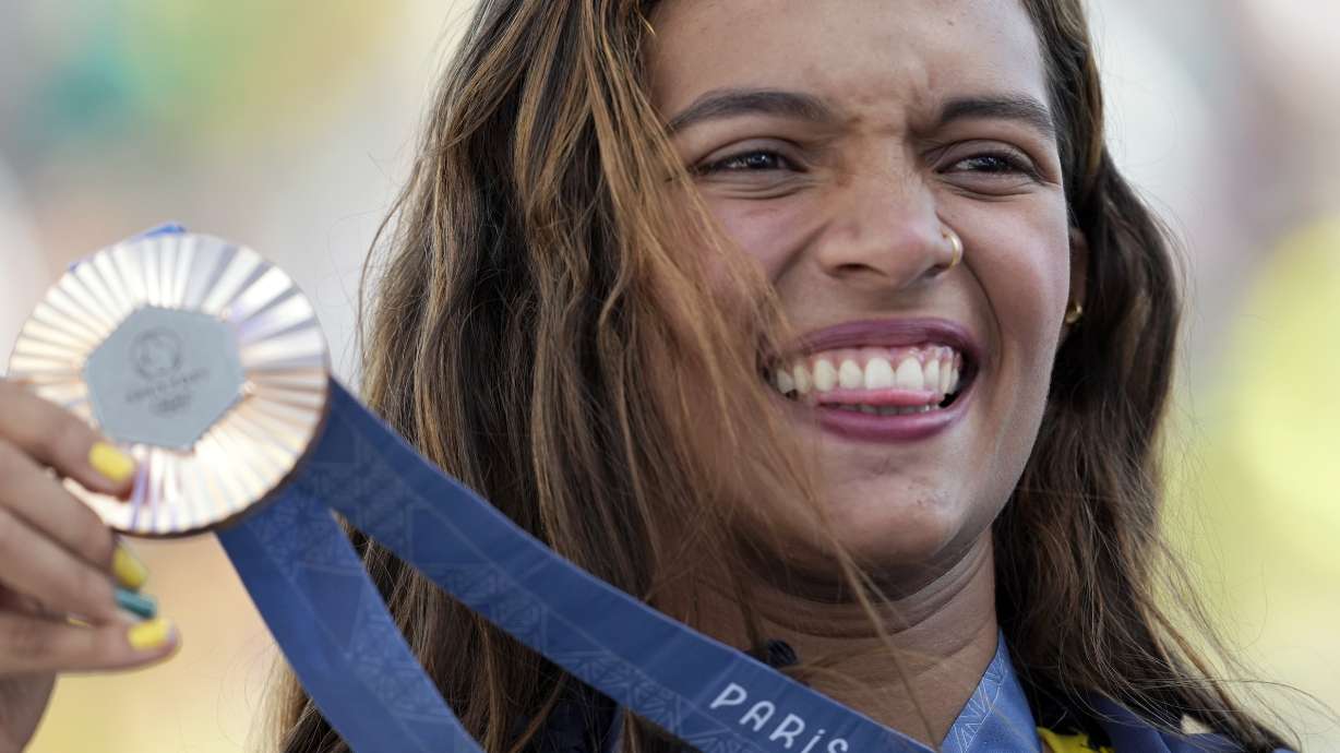 Rayssa Leal, of Brazil, poses with her bronze medal after the women's skateboard street final at the 2024 Summer Olympics, Sunday, July 28, 2024, in Paris, France.