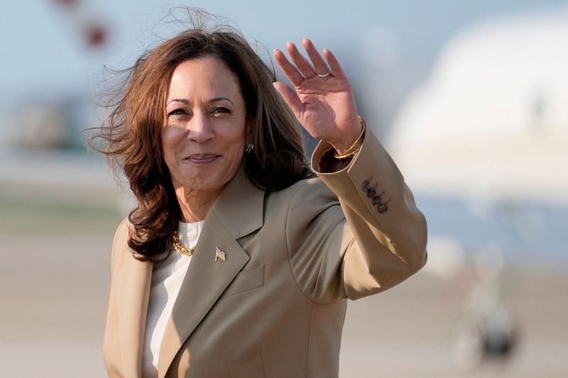 Vice President Kamala Harris waves upon arrival at Joint Base Andrews in Maryland, Saturday. Harris' move to the top of the Democratic ticket injected new life into her party's flailing campaign.