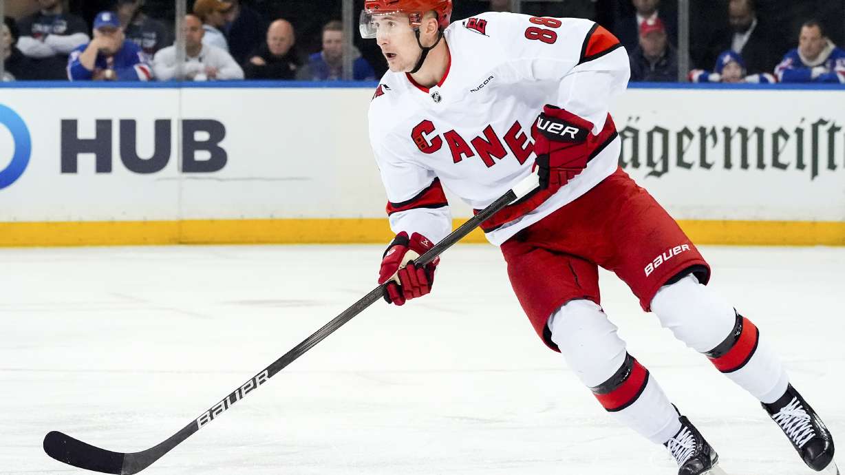 FILE - Carolina Hurricanes center Martin Necas (88) skates with the puck during Game 1 of an NHL hockey Stanley Cup second-round playoff series against the New York Rangers, May 5, 2024, in New York. The Hurricanes agreed to a two-year, $13 million deal with Necas on Monday, July 29.