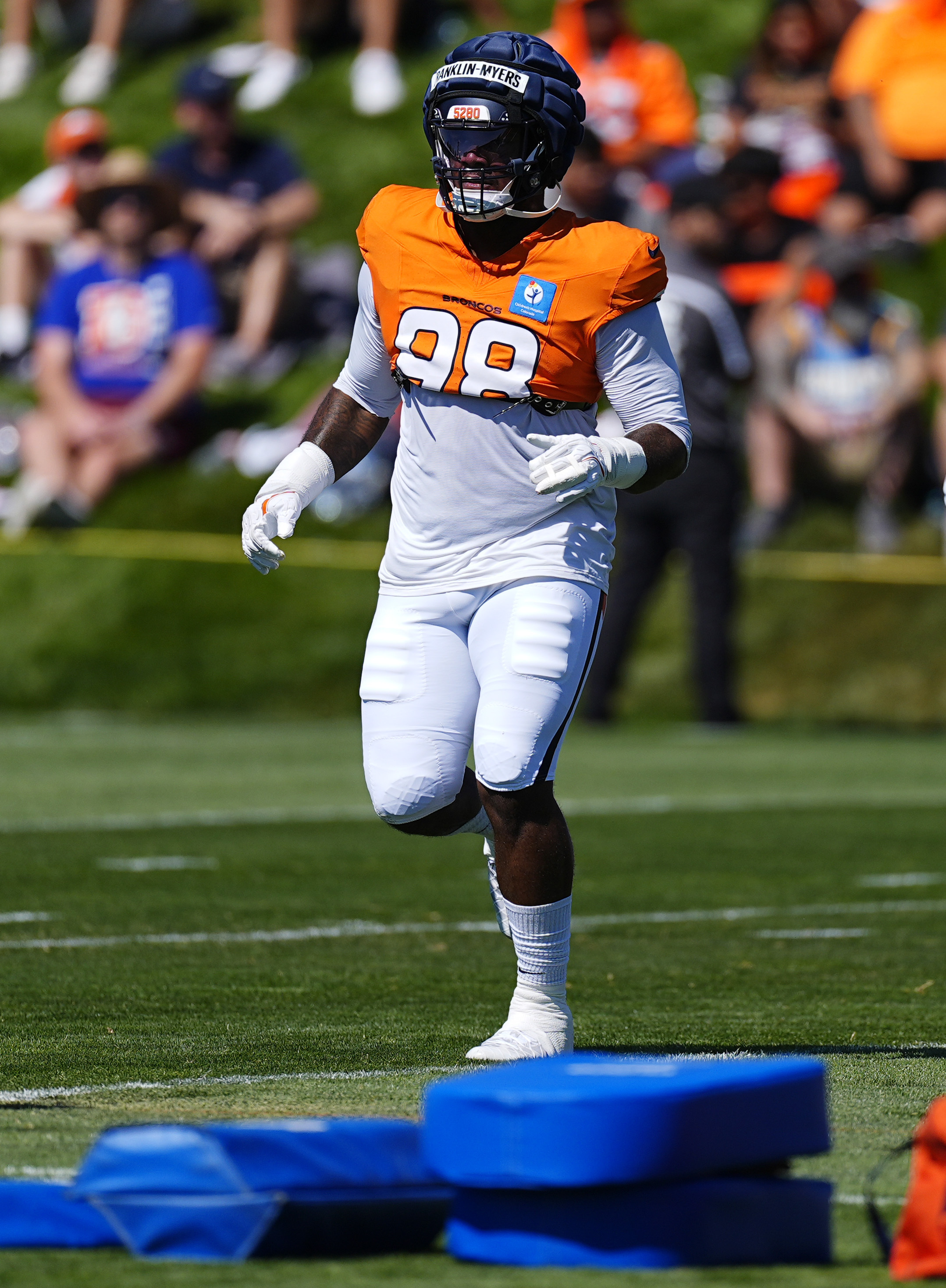 Denver Broncos defensive end John Franklin-Myers takes part in drills during NFL football training camp, Monday, July 29, 2024, at the team's headquarters in Centennial, Colo. 