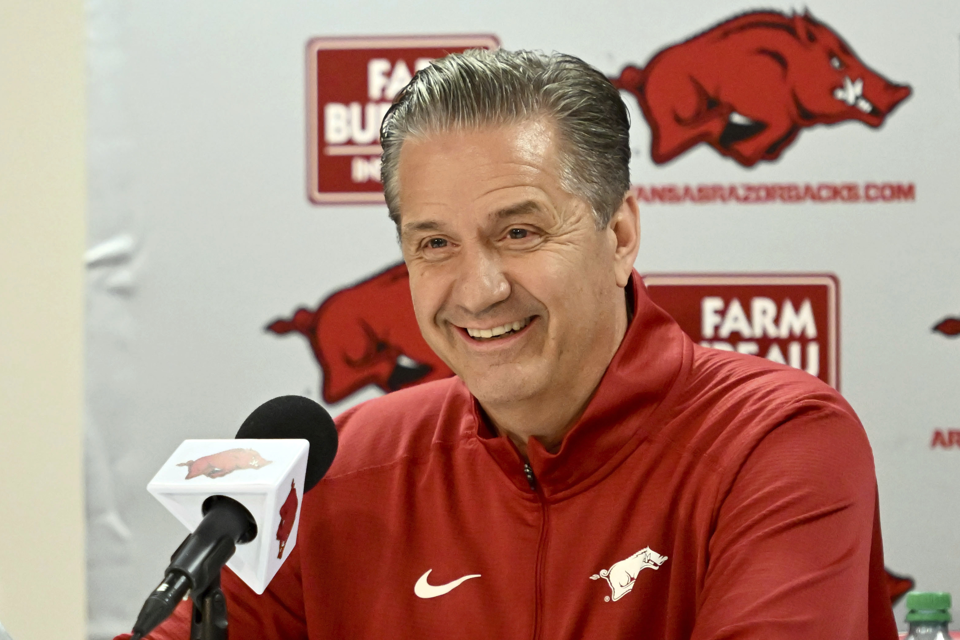 FILE - John Calipari answers questions from reporters during a press conference after being introduced as Arkansas's head head basketball coach Wednesday, April 10, 2024, in Fayetteville, Ark. He's taking over a program that made it to back-to-back Elite Eights followed by a Sweet 16 trip last season. 