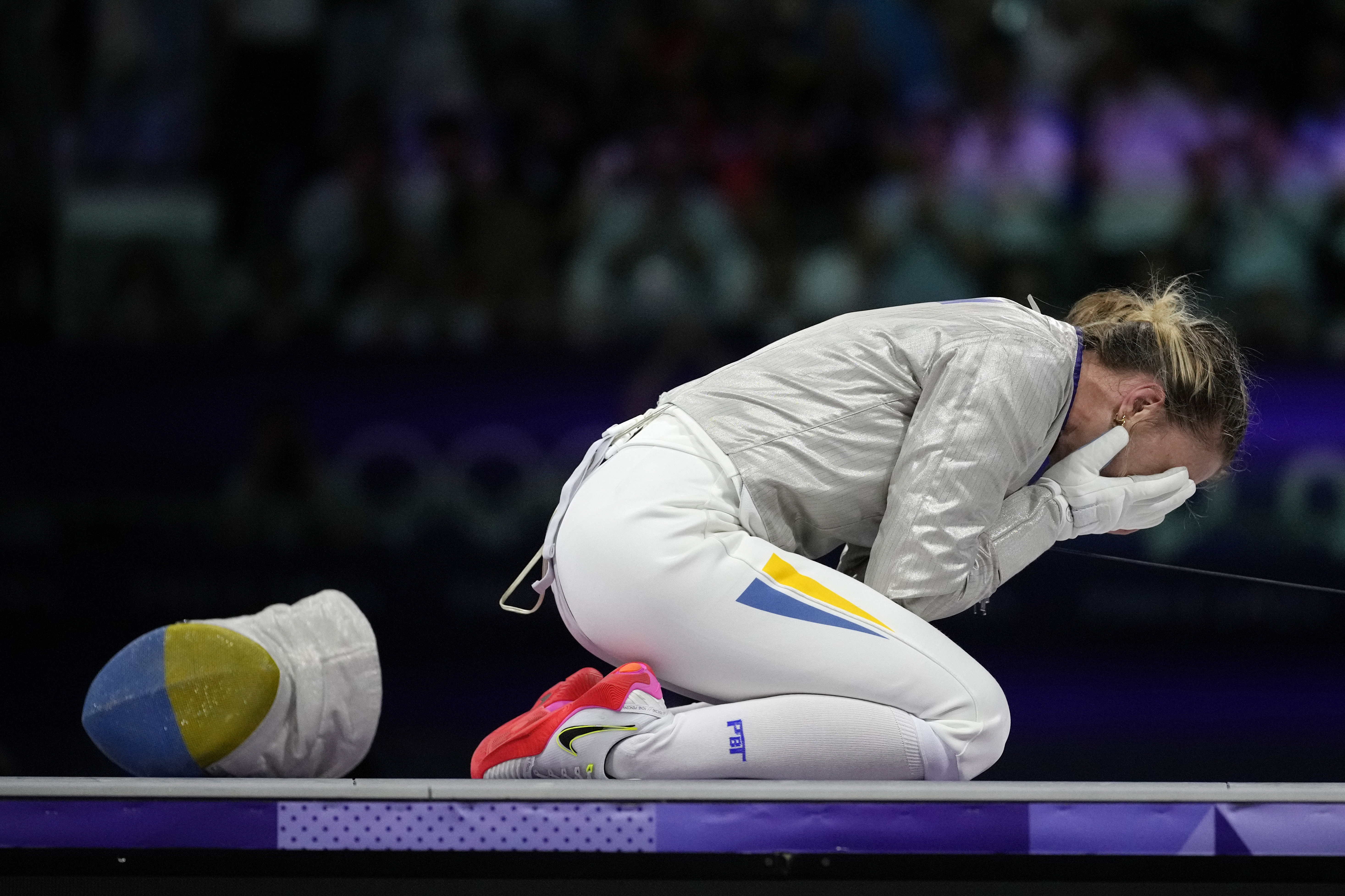 Ukraine's Olga Kharlan celebrates after winning the women's individual Sabre bronze final match against South Korea's Choi Sebin during the 2024 Summer Olympics at the Grand Palais, Monday, July 29, 2024, in Paris, France. 