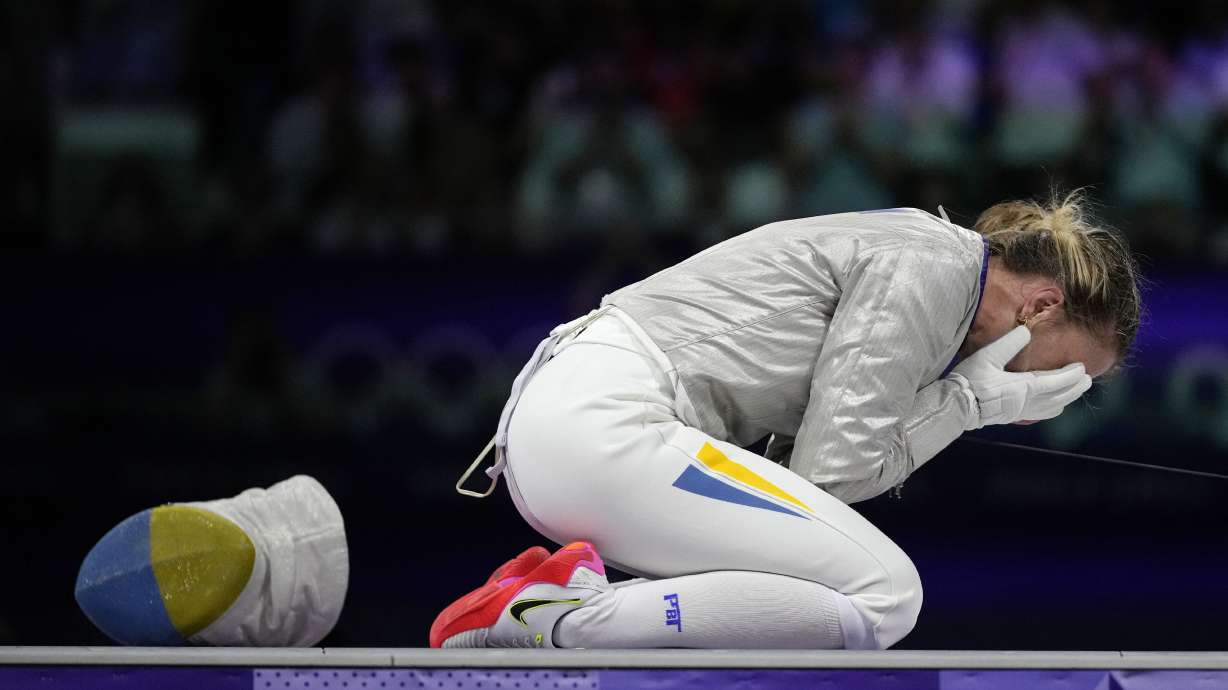 Ukraine's Olga Kharlan celebrates after winning the women's individual Sabre bronze final match against South Korea's Choi Sebin during the 2024 Summer Olympics at the Grand Palais, Monday, July 29, 2024, in Paris, France.