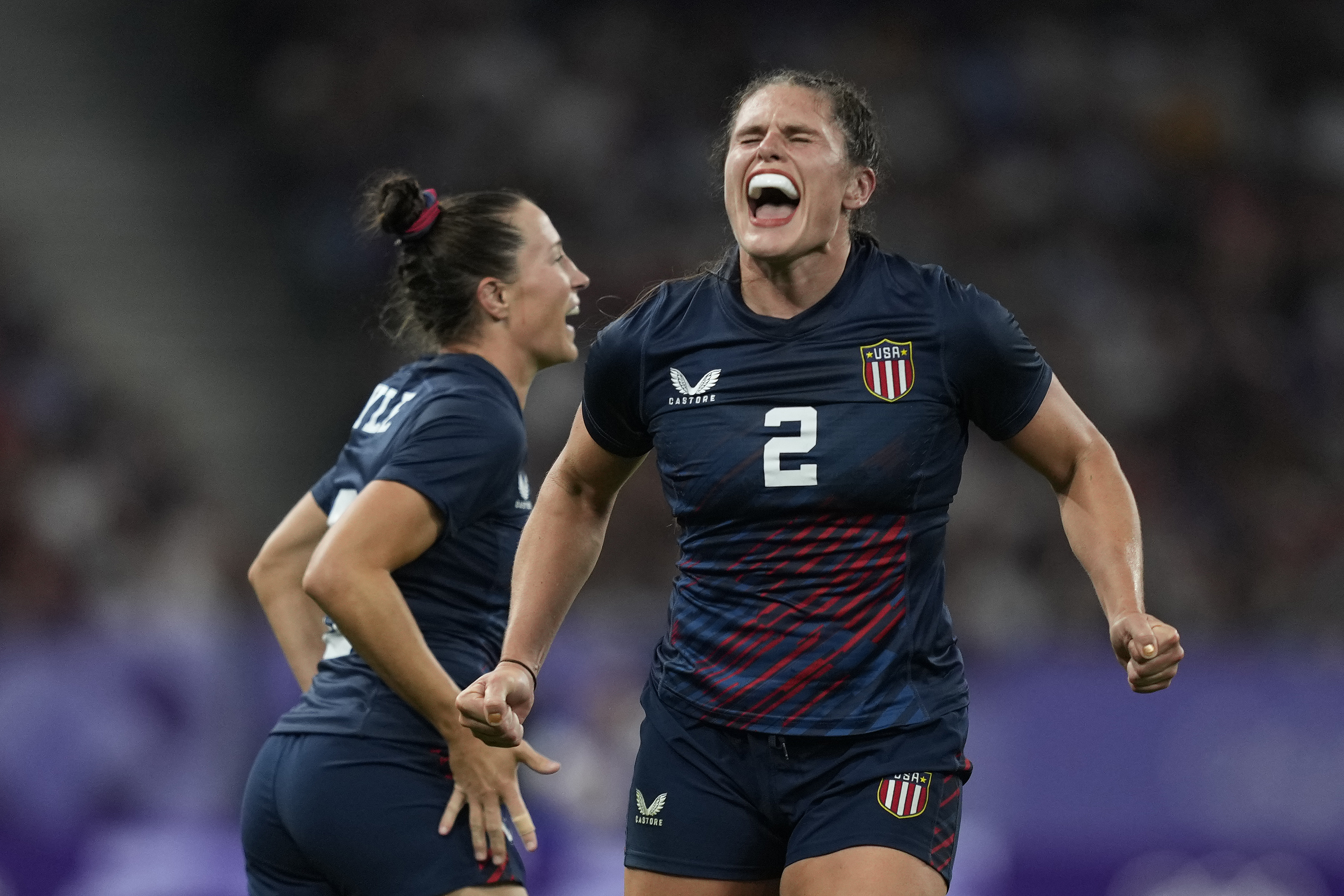 United States' Ilona Maher celebrates after winning their women's quarterfinal Rugby Sevens match between Great Britain and the United States at the 2024 Summer Olympics, in the Stade de France, in Saint-Denis, France, Monday, July 29, 2024. 
