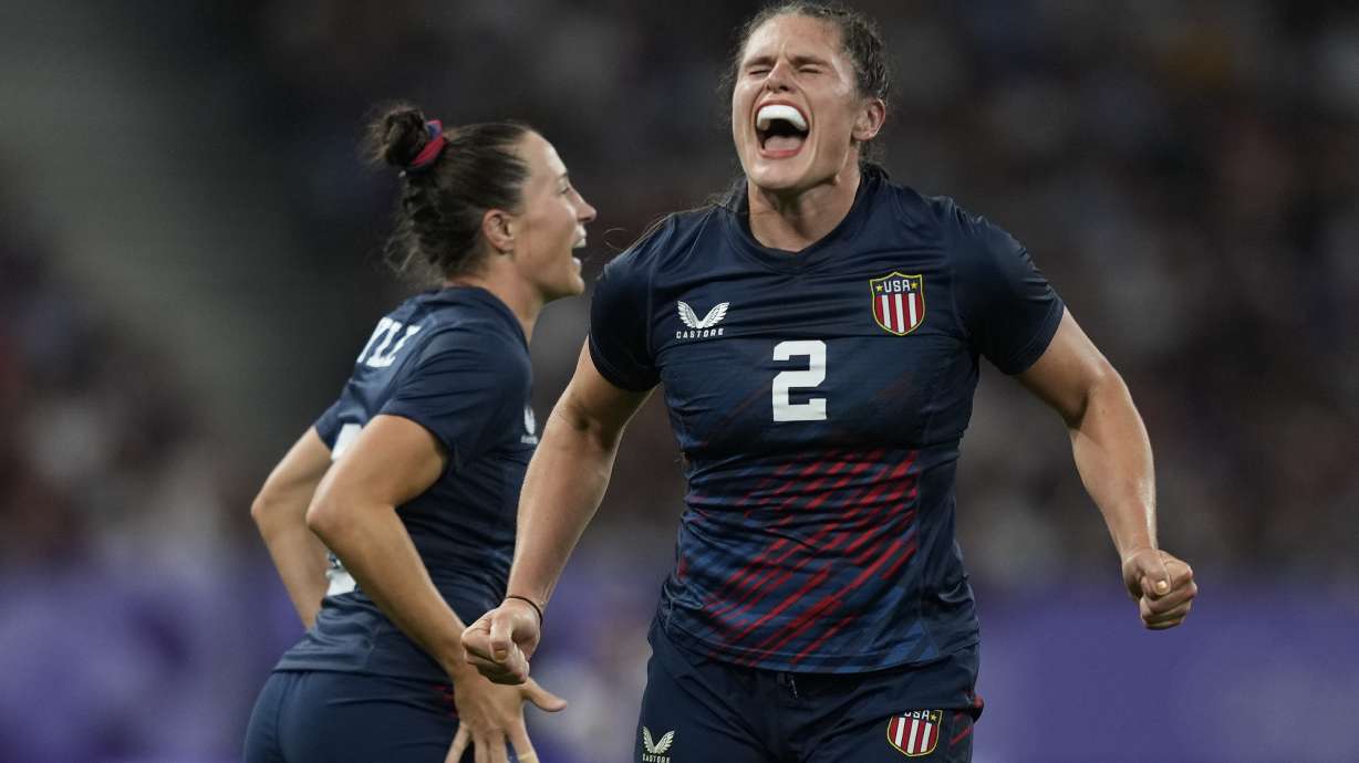United States' Ilona Maher celebrates after winning their women's quarterfinal Rugby Sevens match between Great Britain and the United States at the 2024 Summer Olympics, in the Stade de France, in Saint-Denis, France, Monday, July 29, 2024.