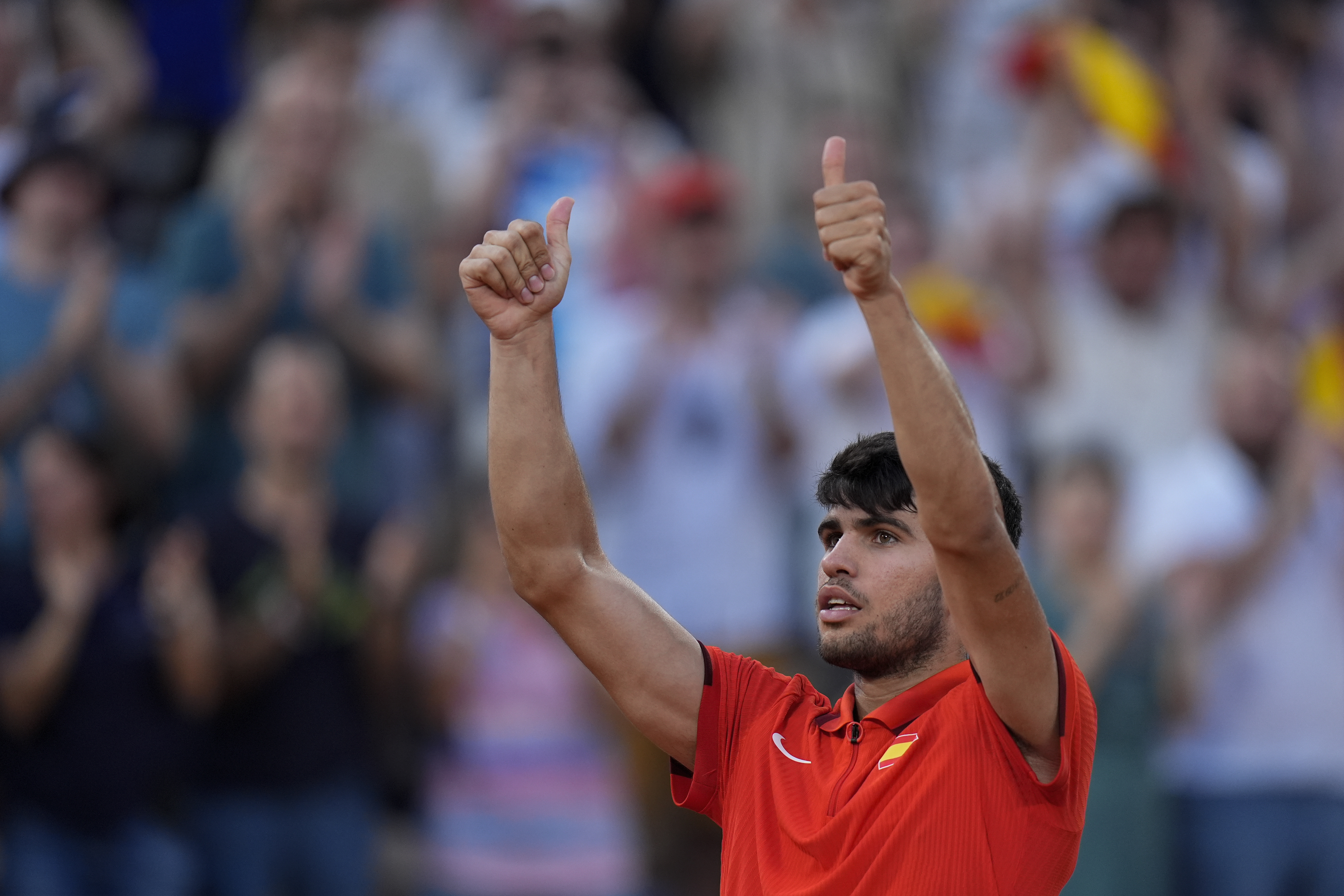 Carlos Alcaraz of Spain celebrates after defeating Tallon Griekspoor of the Netherlands in their men's singles second round match, at the 2024 Summer Olympics, Monday, July 29, 2024, at the Roland Garros stadium in Paris, France.