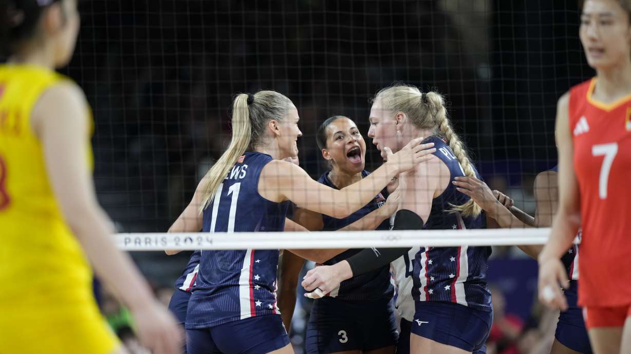 Avery Skinner of the United States celebrates with teammates after setting a point during the group A women's volleyball match between the United States and China at the 2024 Summer Olympics, Monday, July 29, 2024, in Paris, France.