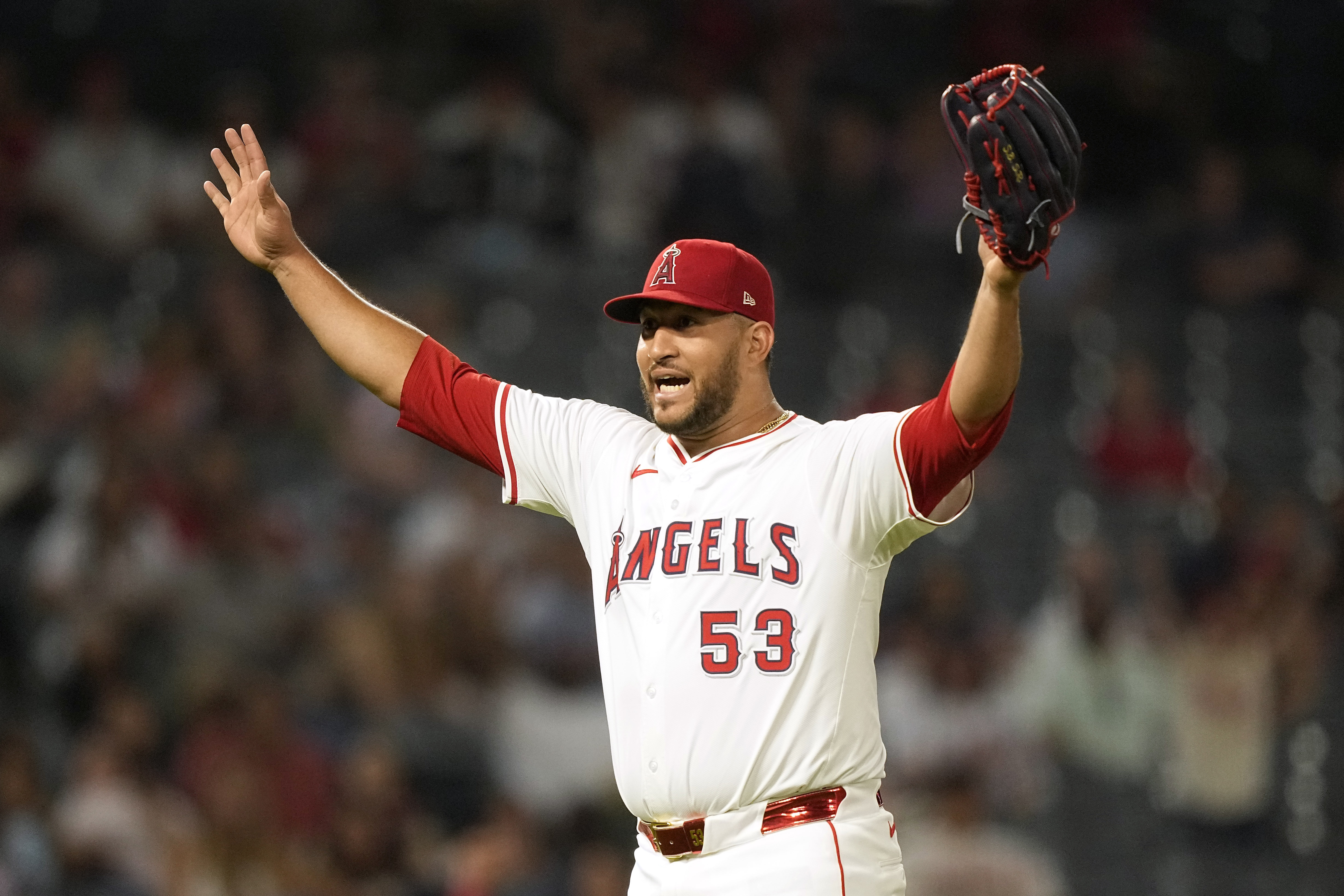 Los Angeles Angels relief pitcher Carlos Estevez gestures after Texas Rangers' Leody Taveras fouled out during the ninth inning of a baseball game against the Texas Rangers Wednesday, July 10, 2024, in Anaheim, Calif. 