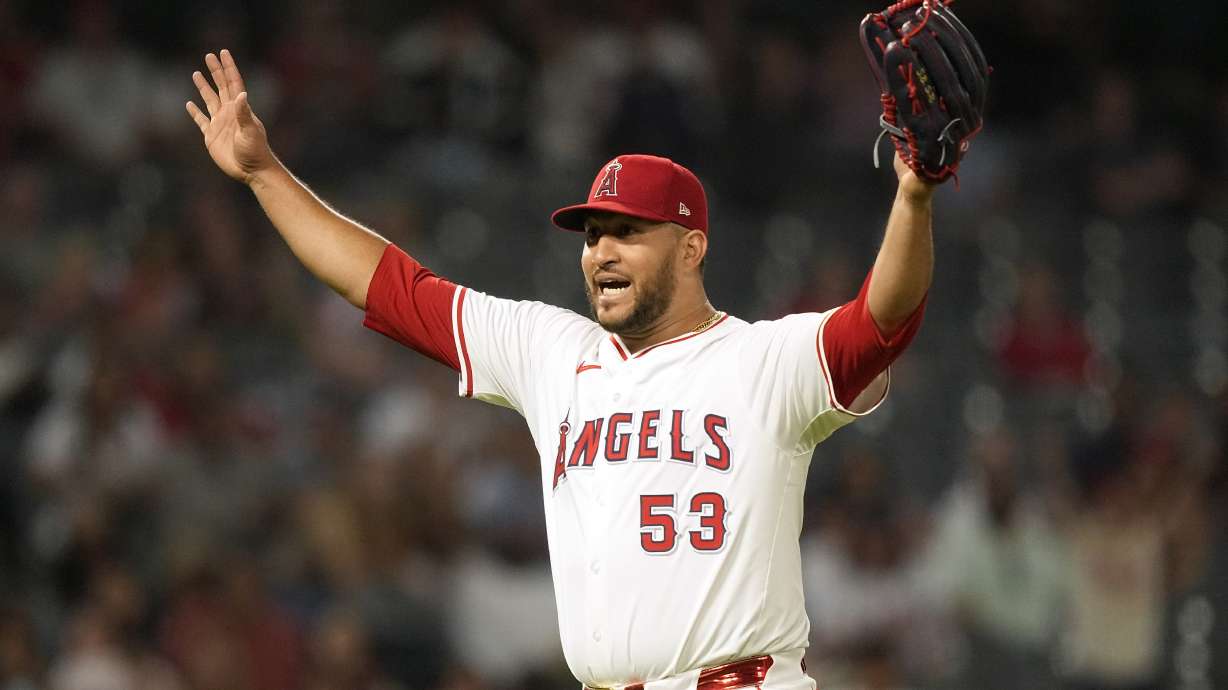 Los Angeles Angels relief pitcher Carlos Estevez gestures after Texas Rangers' Leody Taveras fouled out during the ninth inning of a baseball game against the Texas Rangers Wednesday, July 10, 2024, in Anaheim, Calif.