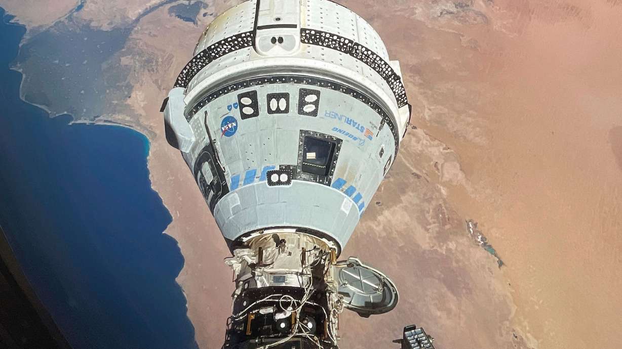This photo provided by NASA shows the Starliner spacecraft docked to the Harmony module of the International Space Station, orbiting 262 miles above Egypt's Mediterranean coast, on June 13.