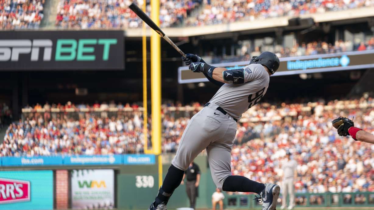 New York Yankees' Aaron Judge hits a solo home run during the first inning of a baseball game against the Philadelphia Phillies, Monday, July 29, 2024, in Philadelphia.
