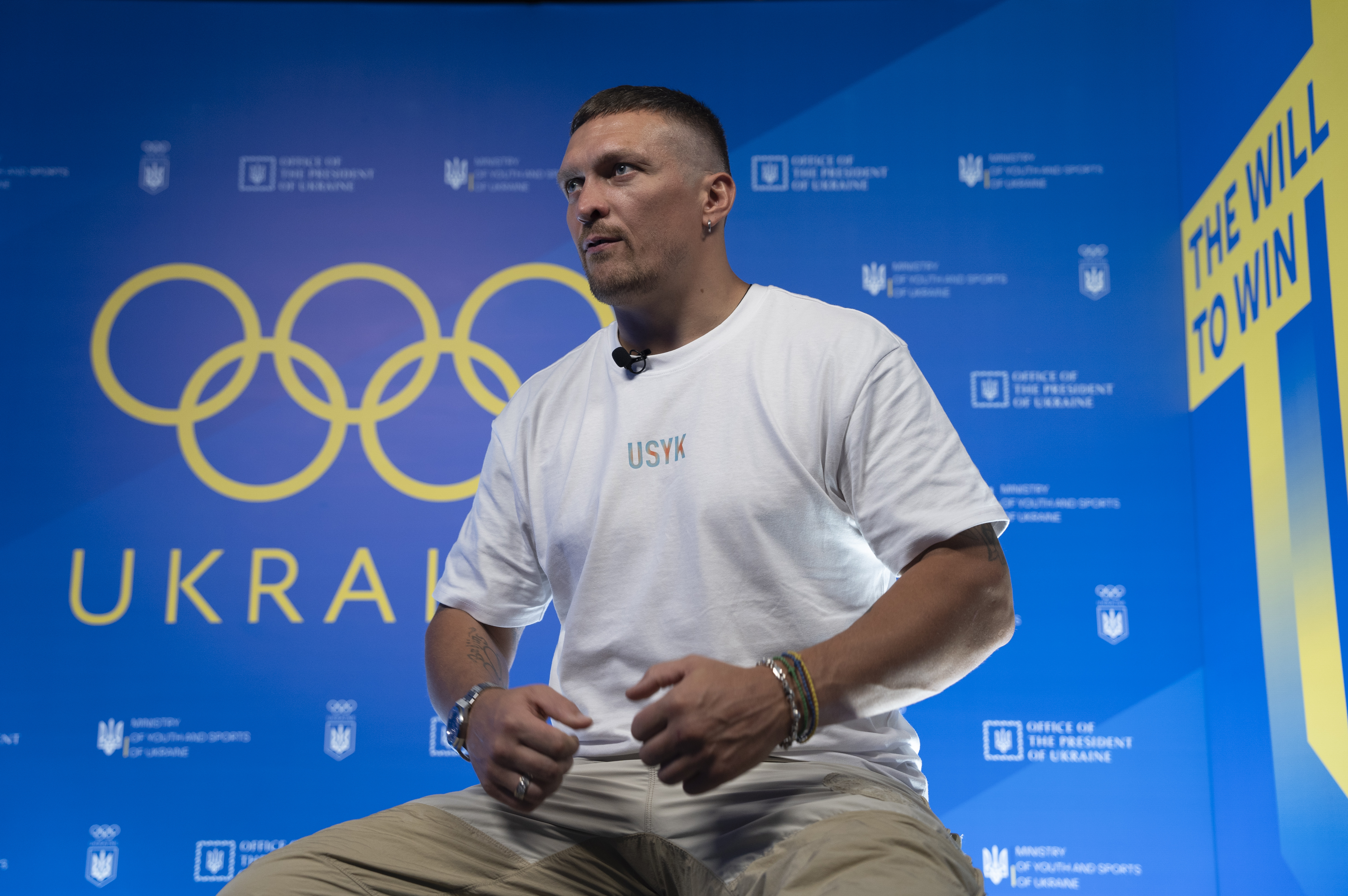 World Heavyweight boxing champion Oleksandr Usyk speaks during a visit to the Ukrainian House in Paris, France at the 2024 Summer Olympics, Monday, July 29, 2024. Usyk has come to Paris to support Ukrainian athletes at the Olympics amid war at home. 