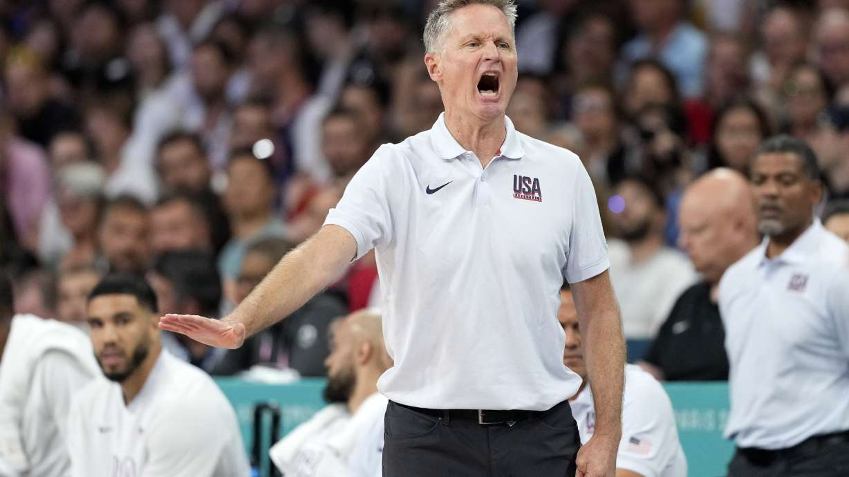 United States head coach Steve Kerr gestures in a men's basketball game against Serbia at the 2024 Summer Olympics, Sunday, July 28, 2024, in Villeneuve-d'Ascq, France.