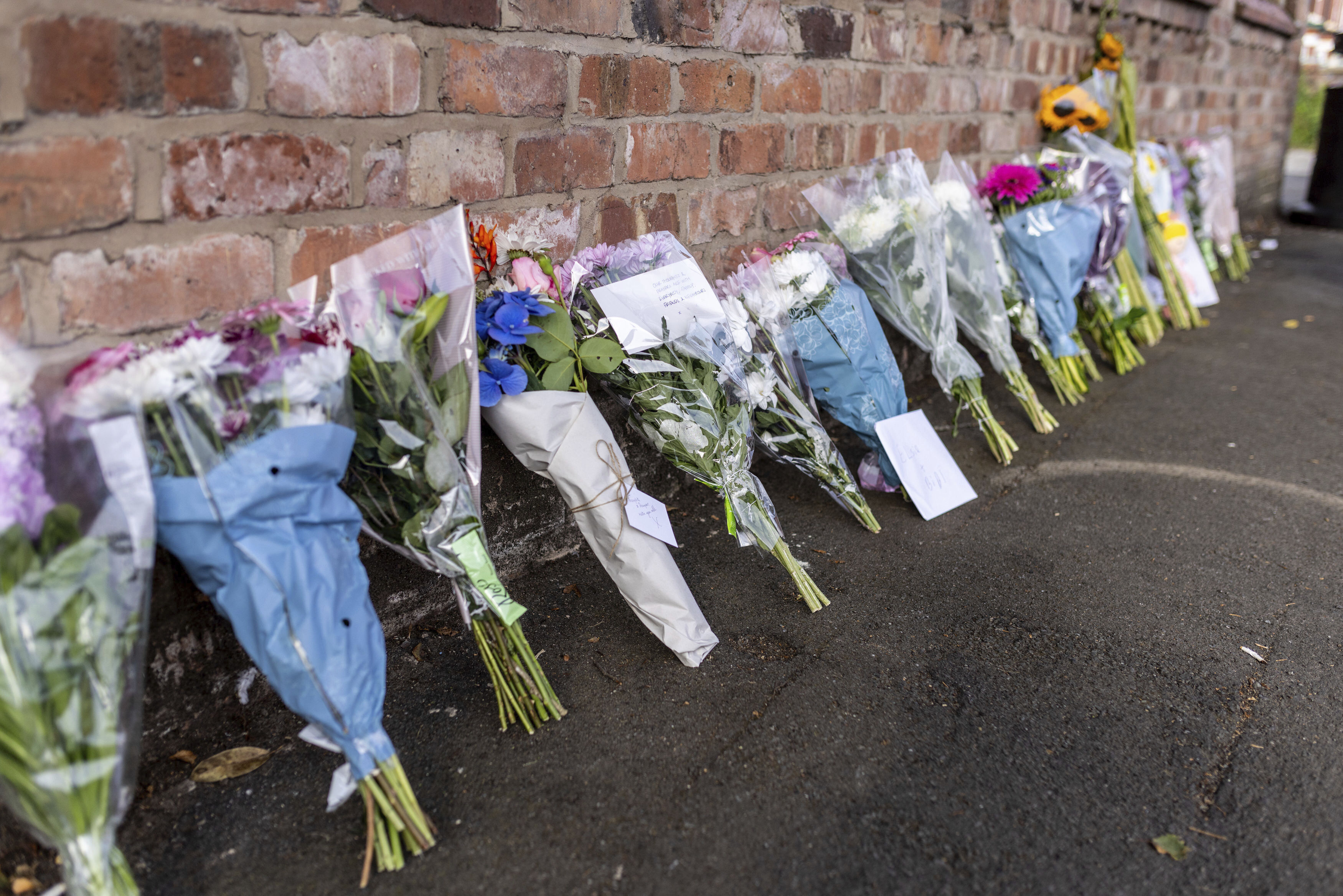 Floral tributes in Hart Street, Southport, Britain, Tuesday where three children have died and nine were injured in a "ferocious" knife attack during a Taylor Swift event at a dance school on Monday. 