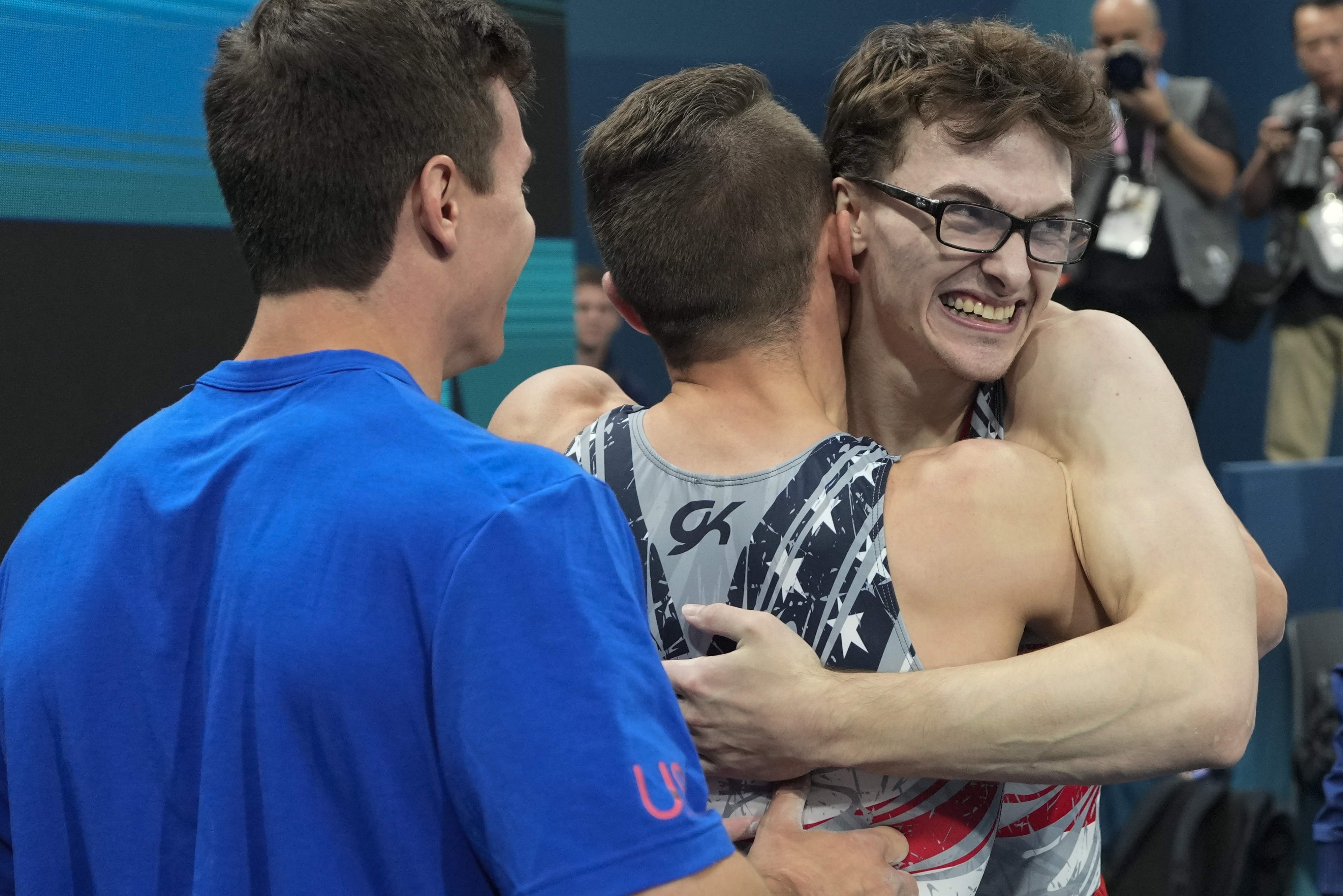 Stephen Nedoroscik, of United States, gets a hug from Paul Juda after last rotation during the men's artistic gymnastics team finals round at Bercy Arena at the 2024 Summer Olympics, Monday, July 29, 2024, in Paris, France.
