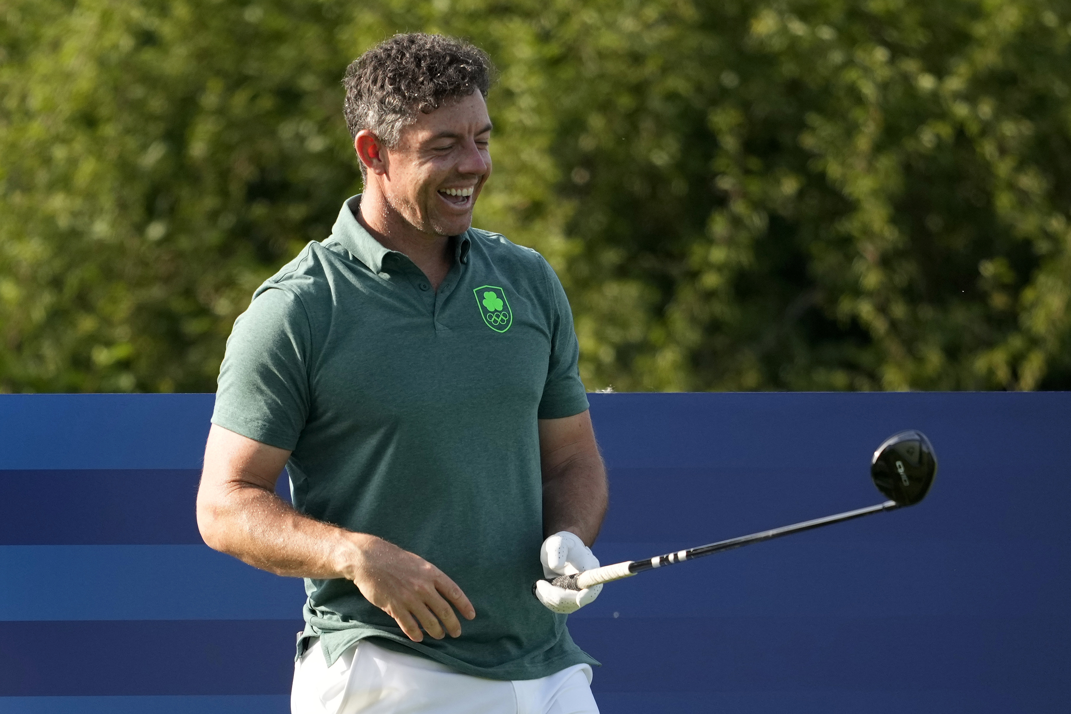 Rory McIlroy, of Ireland, laughs on the sixth tee box during a practice round for the men's golf event at the 2024 Summer Olympics, Tuesday, July 30, 2024, at Le Golf National in Saint-Quentin-en-Yvelines, France. 
