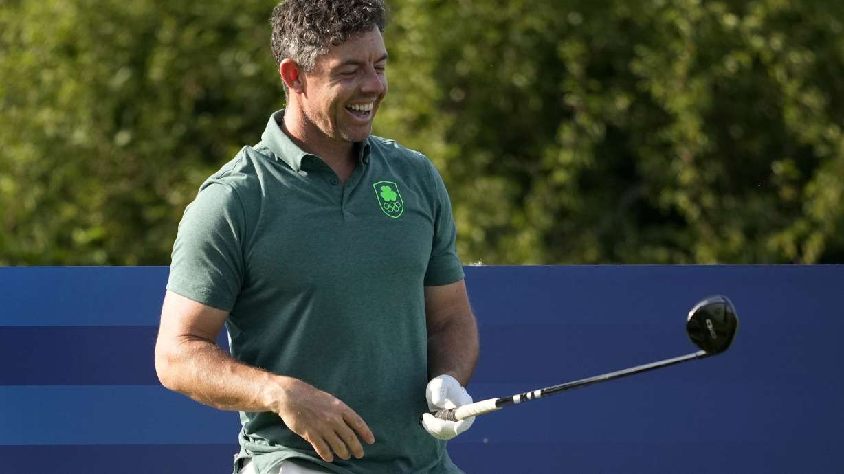 Rory McIlroy, of Ireland, laughs on the sixth tee box during a practice round for the men's golf event at the 2024 Summer Olympics, Tuesday, July 30, 2024, at Le Golf National in Saint-Quentin-en-Yvelines, France.