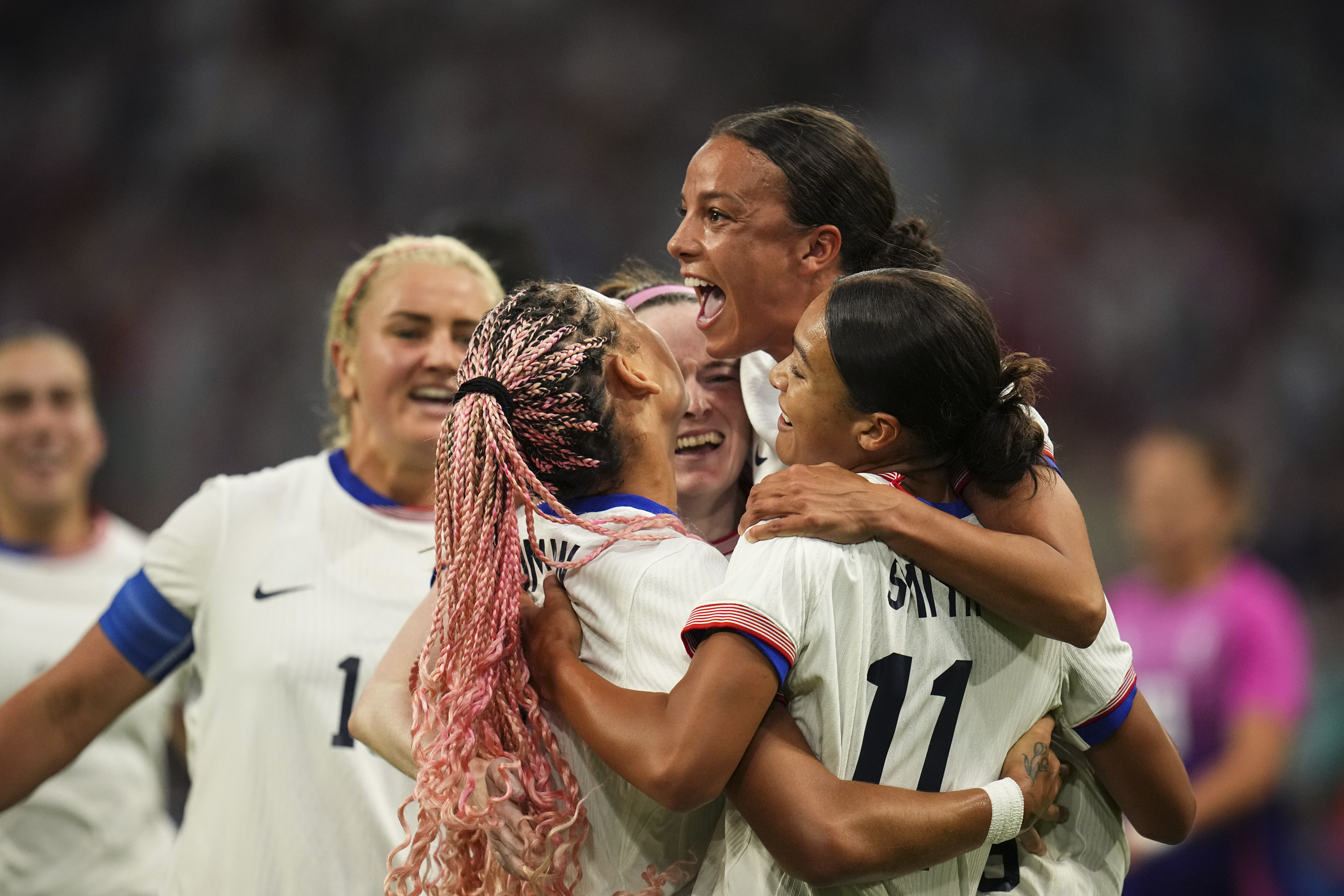 Players from the United States celebrate after Sophia Smith scored their side's first goal, during the women's Group B soccer match between the United States and Germany at the Velodrome stadium, during the 2024 Summer Olympics, Sunday, July 28, 2024, in Marseille, France. 