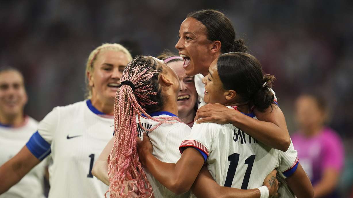 Players from the United States celebrate after Sophia Smith scored their side's first goal, during the women's Group B soccer match between the United States and Germany at the Velodrome stadium, during the 2024 Summer Olympics, Sunday, July 28, 2024, in Marseille, France.