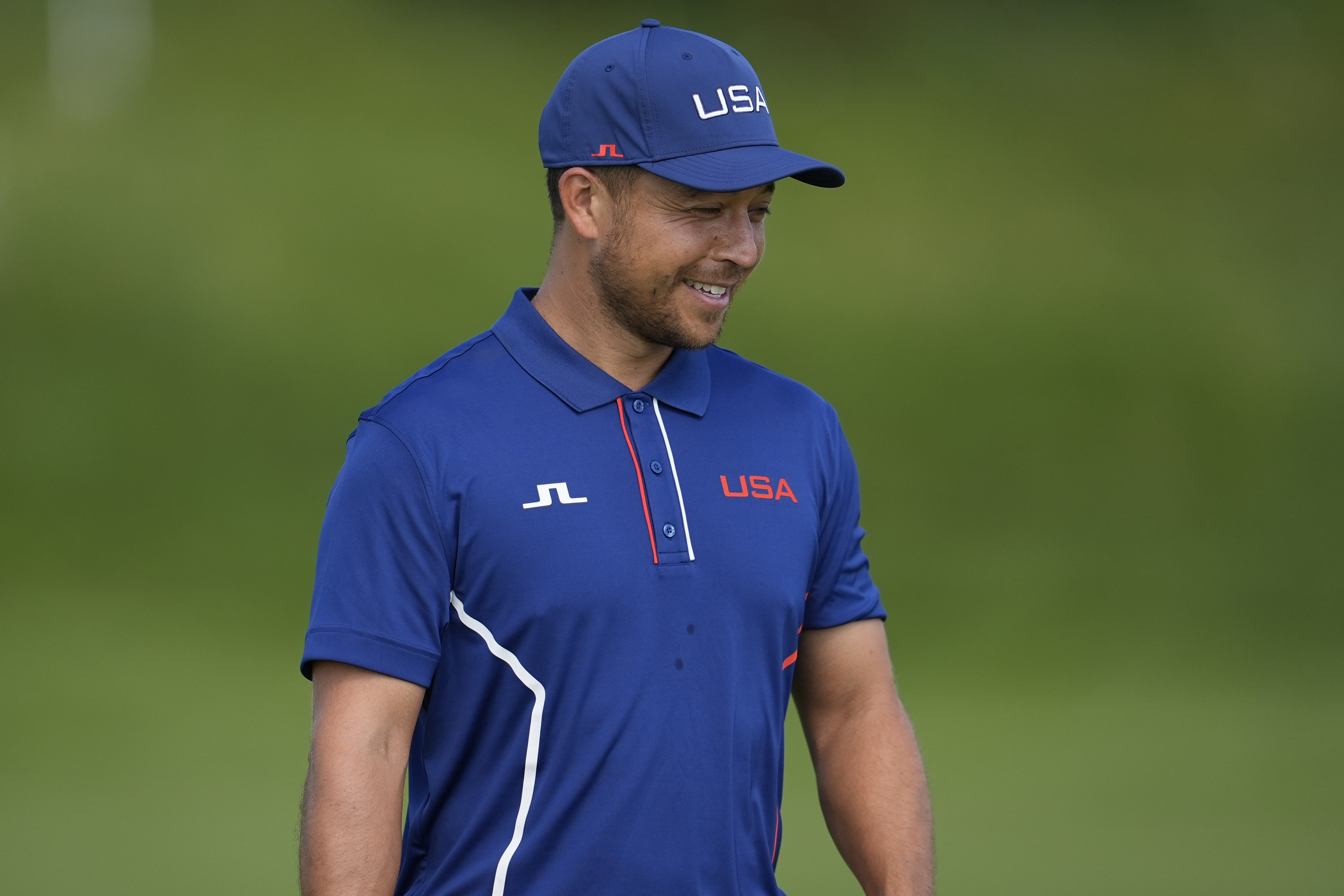 Xander Schauffele, of the United States, walks on the 10th green during a practice round for the men's golf event at the 2024 Summer Olympics, Monday, July 29, 2024, at Le Golf National in Saint-Quentin-en-Yvelines, France. 