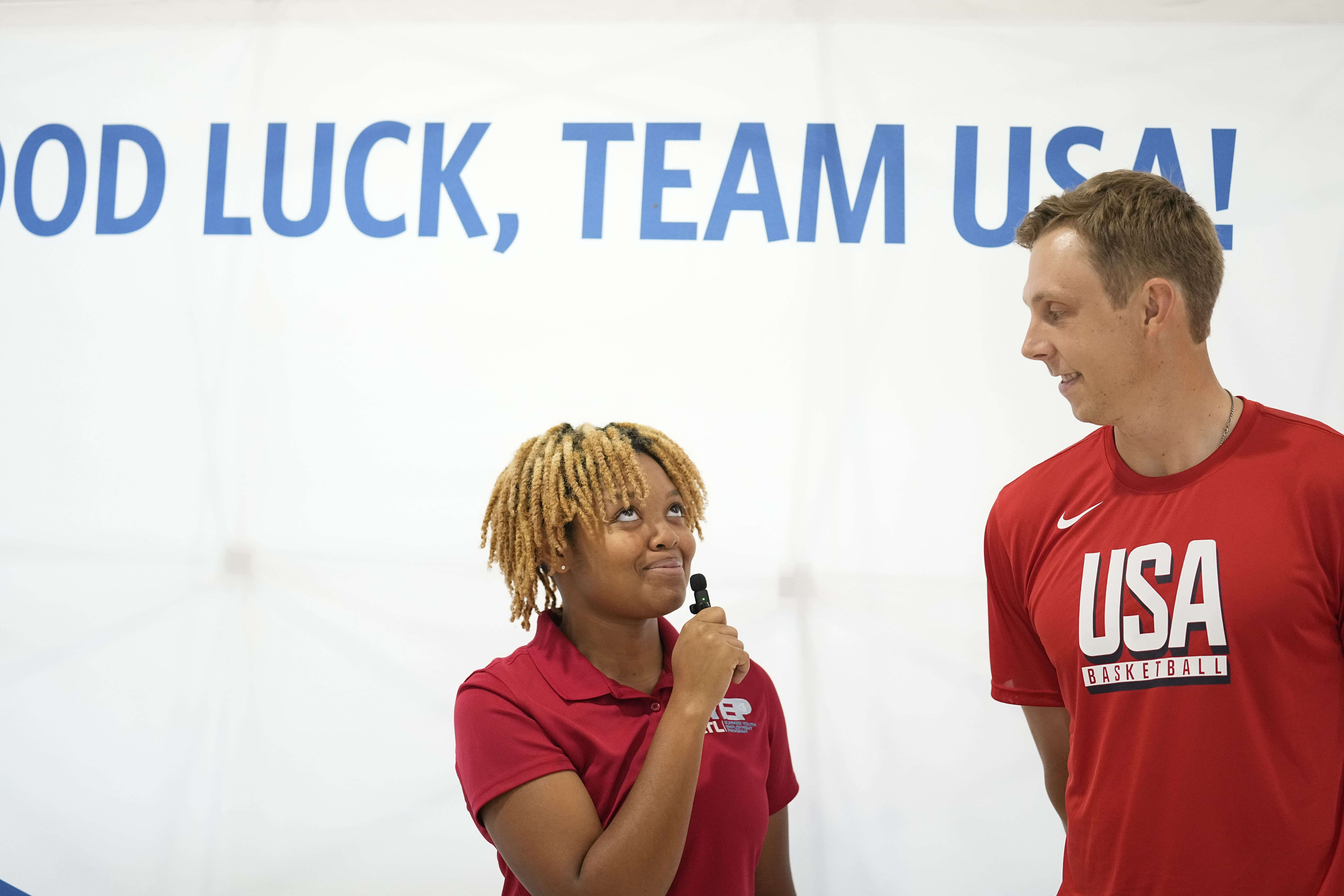 Team USA basketball athlete, Canyon Barry, talks with people before departing from the airport on Wednesday, July 17, 2024, in Atlanta. 
