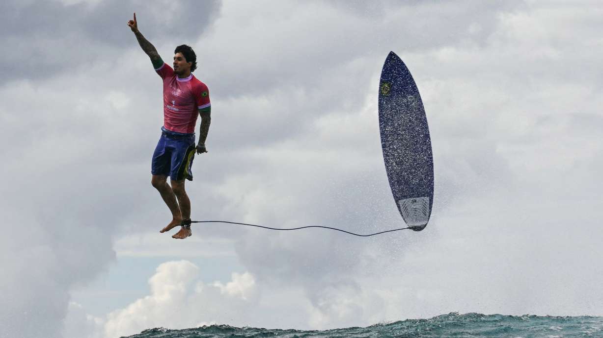 Brazil's Gabriel Medina reacts after his monster 9.90 score in the 5th heat of the men's surfing round 3 on the French Polynesian Island of Tahiti on Monday.