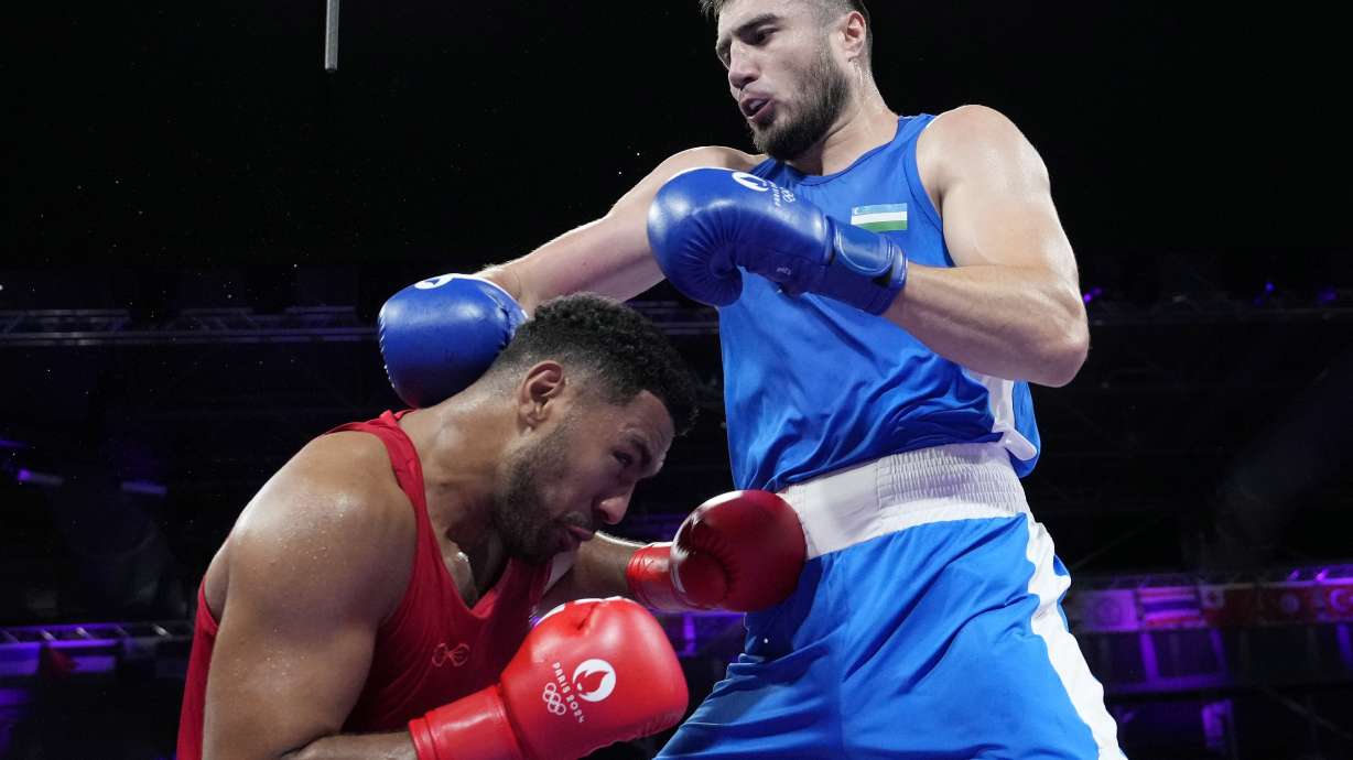 Uzbekistan's Bakhodir Jalolov hits Norway's Omar Shiha in their men's +92 kg preliminary boxing match at the 2024 Summer Olympics, Monday, July 29, 2024, in Paris, France.