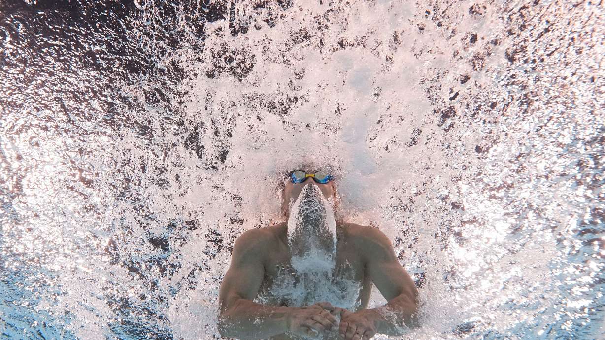Tomoru Honda, of Japan, competes during a heat in the men's 200-meter butterfly at the 2024 Summer Olympics, Tuesday, July 30, 2024, in Nanterre, France.