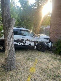 An Ogden police patrol car after hitting a building following a crash in a nearby intersection.
