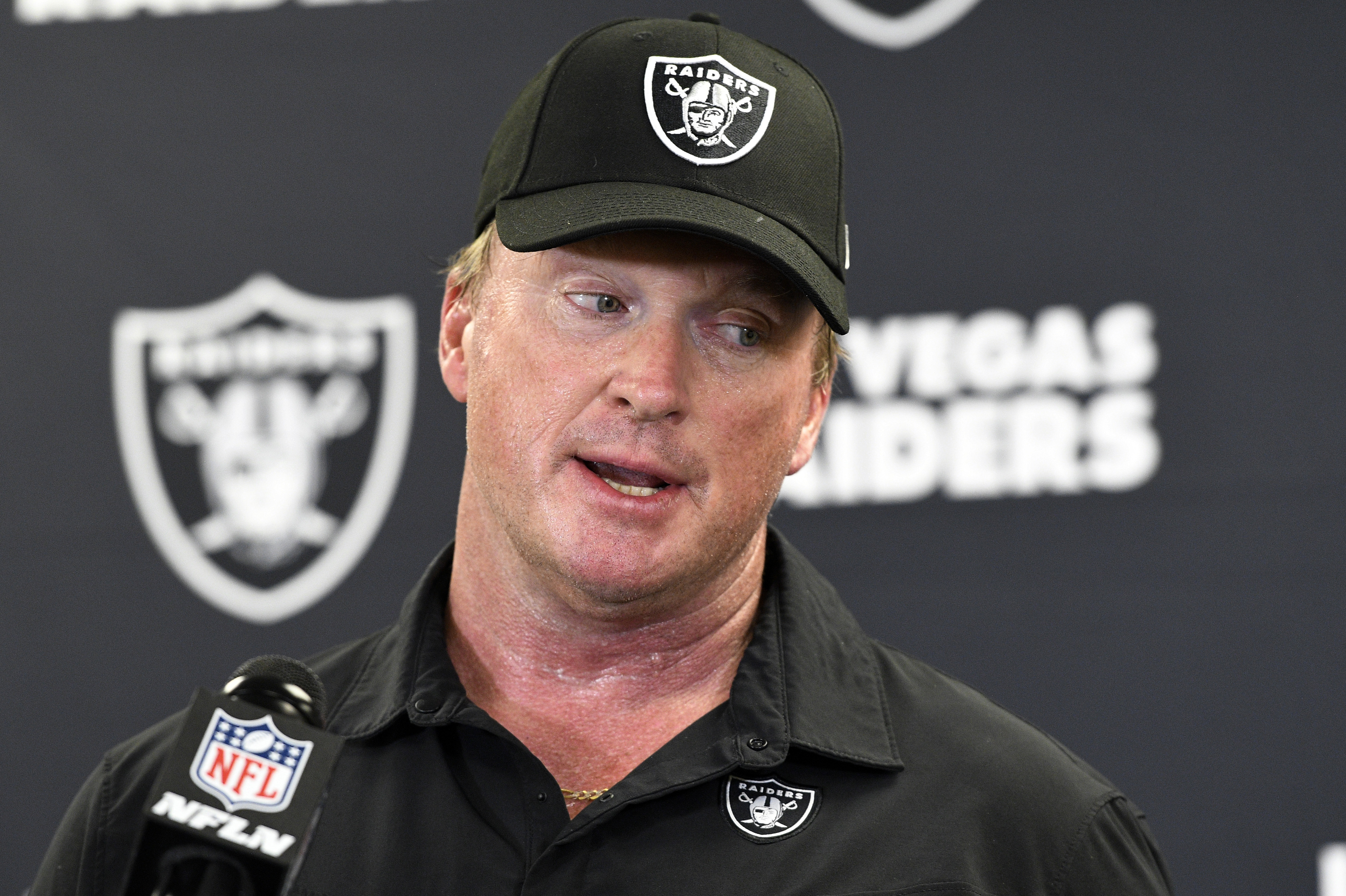 FILE - Las Vegas Raiders head coach Jon Gruden speaks with the media following an NFL football game against the Pittsburgh Steelers in Pittsburgh, Sept. 19, 2021. Gruden is asking the entire Nevada Supreme Court to reconsider a decision by a three-justice panel to throw out a lawsuit he filed against the NFL over emails leaked to the media before he resigned as coach of the Las Vegas Raiders in 2021. 