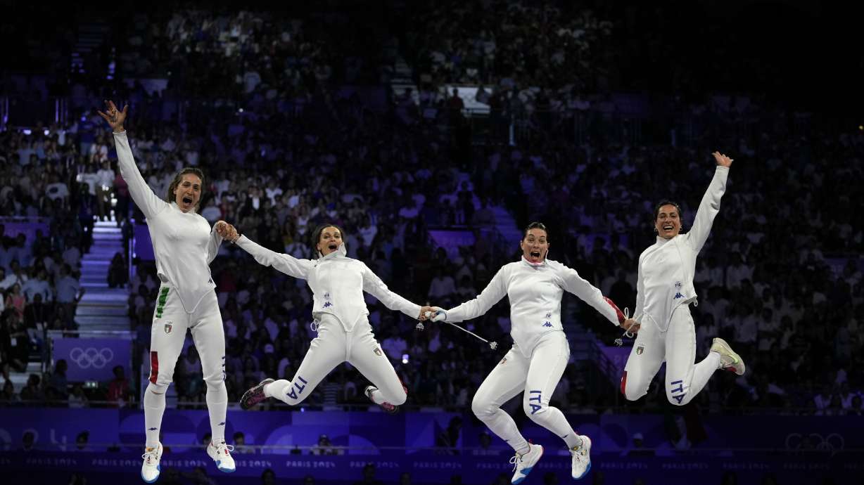 Italy's Alberta Santuccio, second right, celebrates with her teammates Rossella Fiamingo, second left, Giulia Rizzi, left, and Mara Navarria after winning the women's team Epee final match against France during the 2024 Summer Olympics at the Grand Palais, Friday, June 7, 2019, in Paris, France.