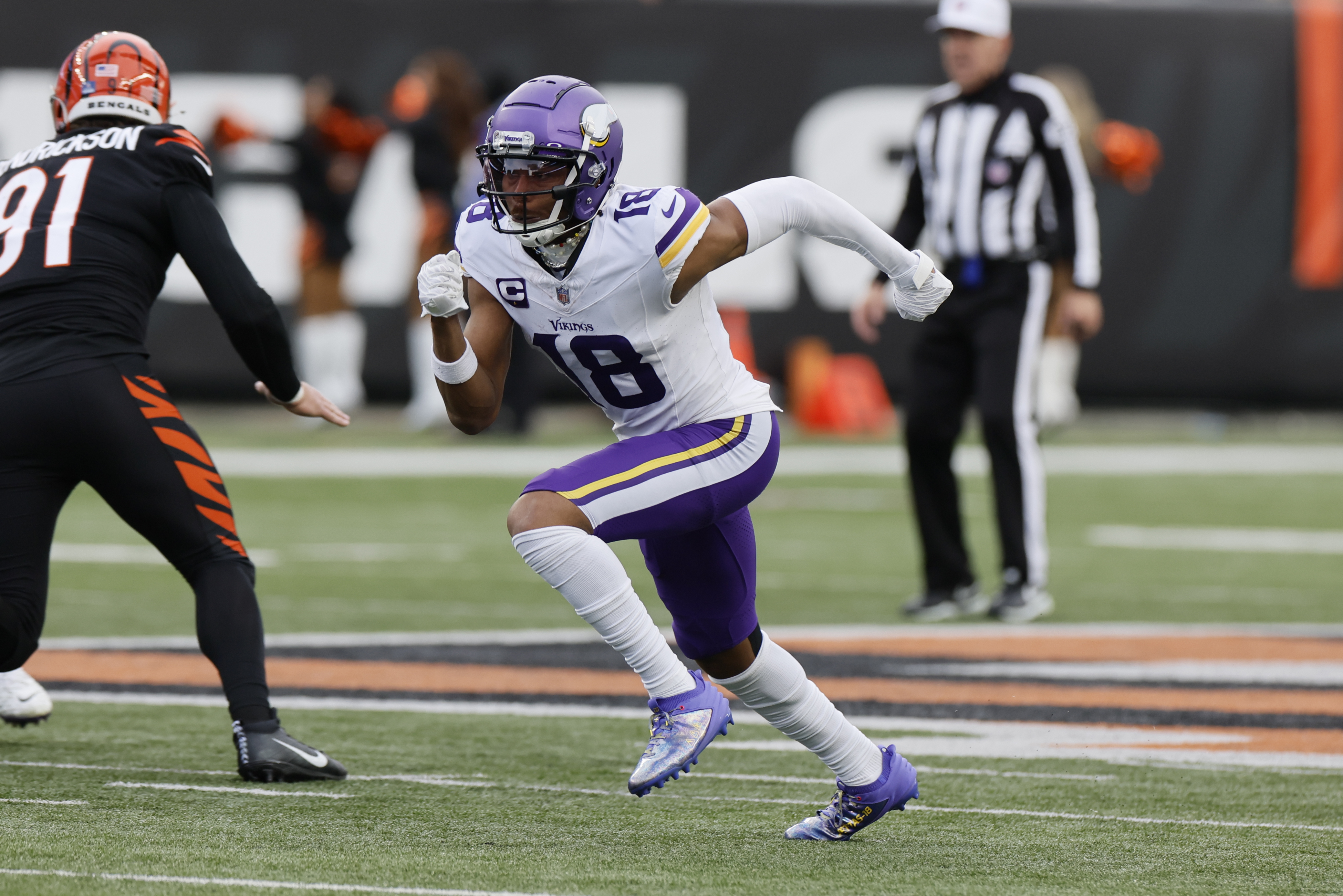 FILE - Minnesota Vikings receiver Justin Jefferson plays against the Cincinnati Bengals during an NFL football game Saturday, Dec. 16, 2023, in Cincinnati. Professional sports teams across Ohio would be required to use playing surfaces of not less than 90% natural grass under legislation announced Tuesday, July 30, 2024. 