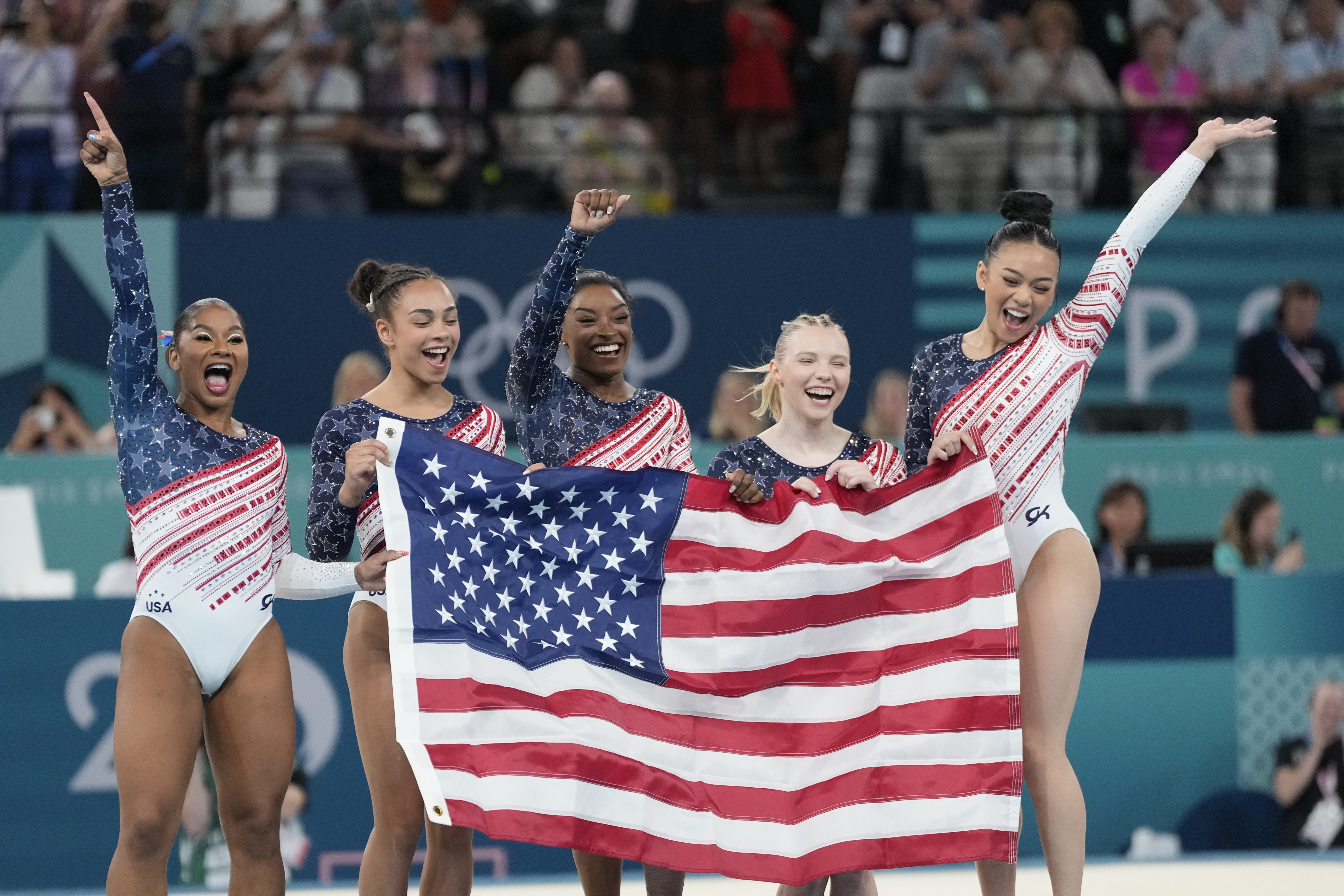 Members of Team USA celebrate after winning the gold medal in the women's artistic gymnastics team finals round at Bercy Arena at the 2024 Summer Olympics, Tuesday, July 30, 2024, in Paris, France. 