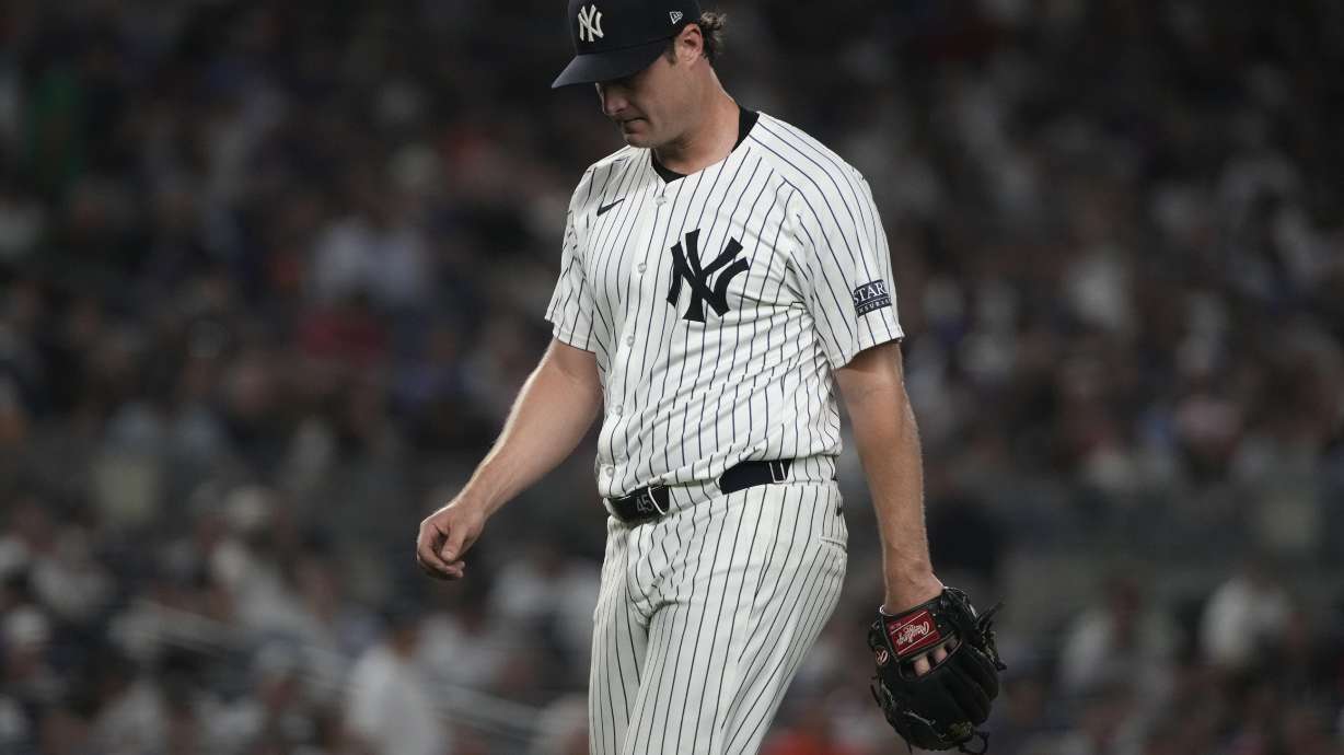 New York Yankees' Gerrit Cole walks to the dugout during the sixth inning of a baseball game against the New York Mets, Wednesday, July 24, 2024, in New York.