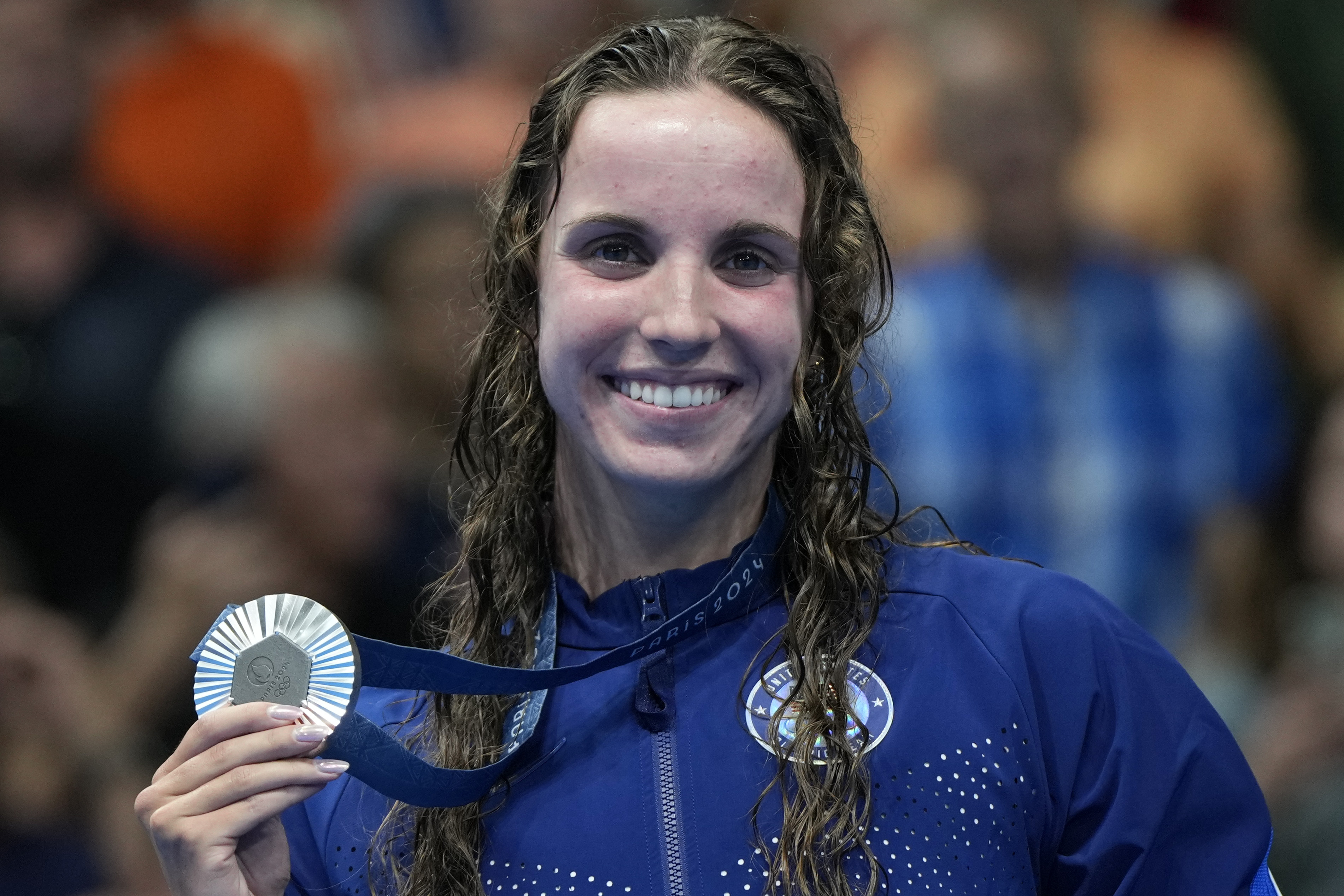 Regan Smith, of the United States, poses with her silver medal for the women's 100-meter backstroke final at the 2024 Summer Olympics, Tuesday, July 30, 2024, in Nanterre, France. 