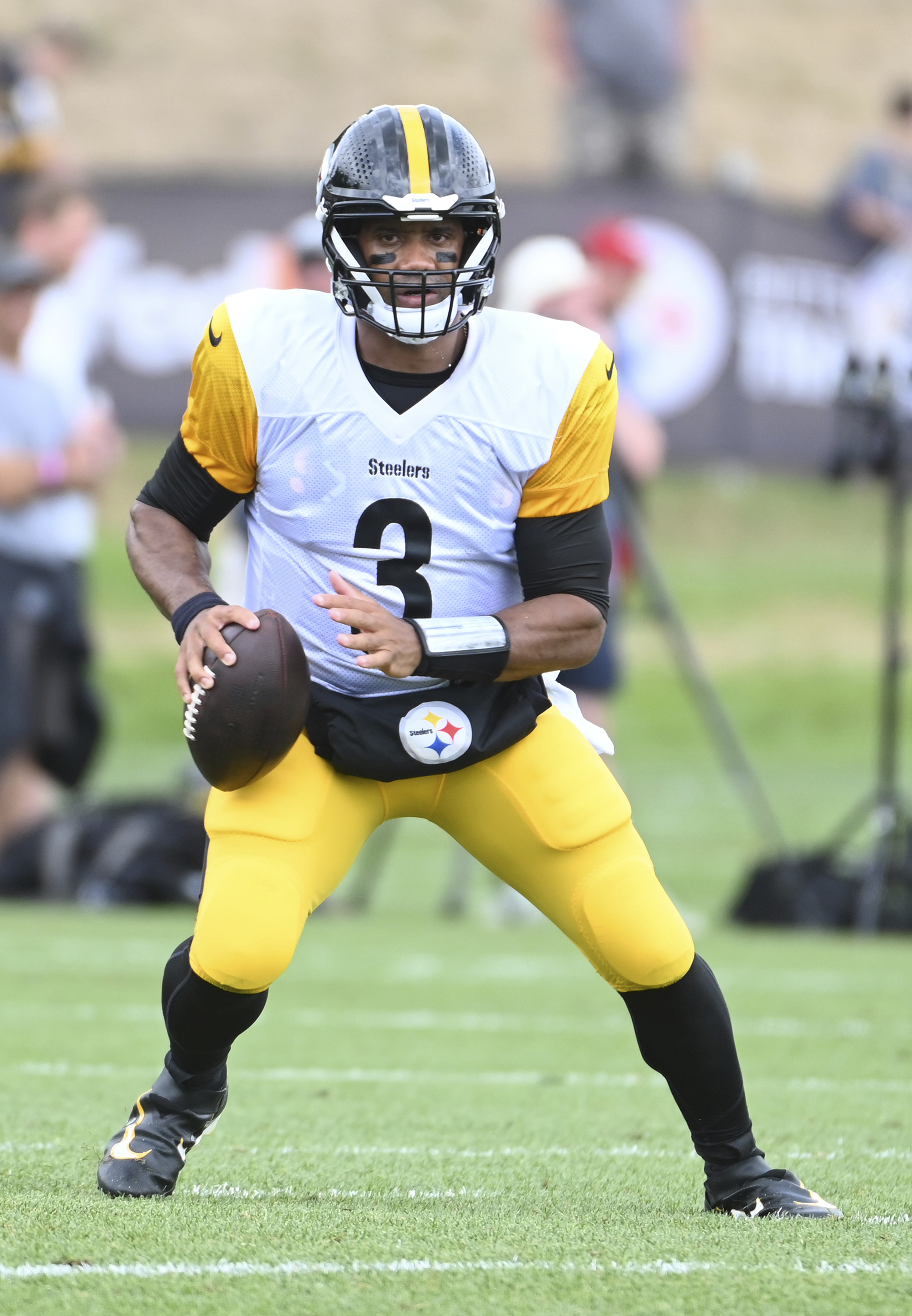 Pittsburgh Steelers quarterback Russell Wilson scrambles out of the pocket during the NFL football team's training camp in Latrobe, Pa., Tuesday, July 30, 2024. 
