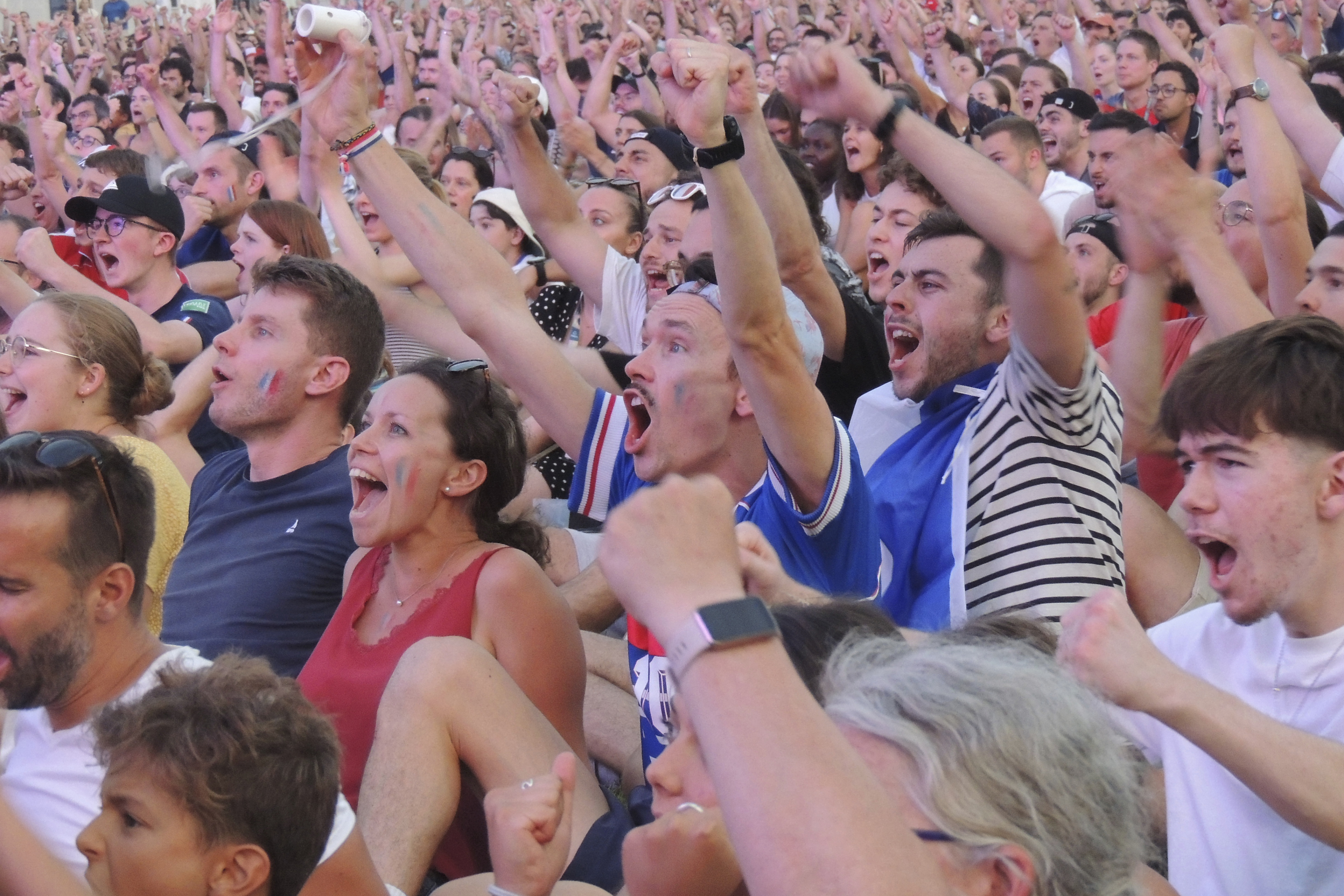 Fans cheer in Club France, an Olympic fan zone, in northern Paris, France, Tuesday, July 30, 2024. 