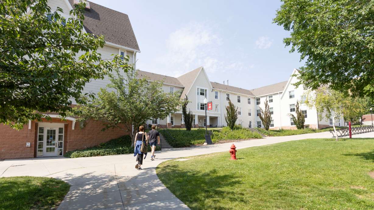 Jen Cain and her son Jude Cain, tour the Chapel Glen residence halls, which were a part of the 2002 Olympic Village at the University of Utah in Salt Lake City on Tuesday. The university's president was struck by the size of the athlete housing in Paris.
