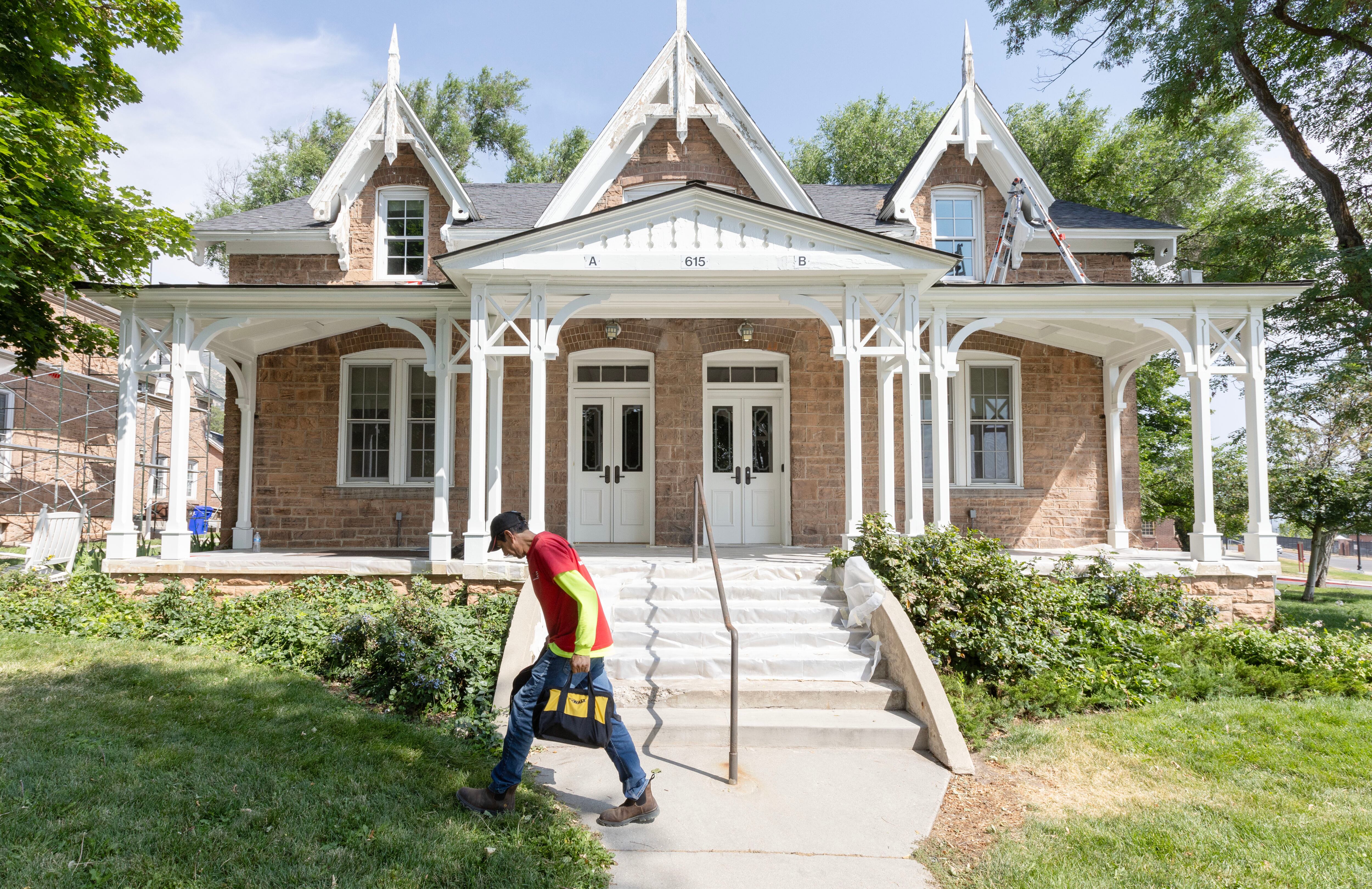 Franco Lera, a worker with the University of Utah, carries his tools around while working on a building in Officers Circle, which was a part of the 2002 Olympic Village on the campus of the University of Utah in Salt Lake City on Tuesday, July 30, 2024.