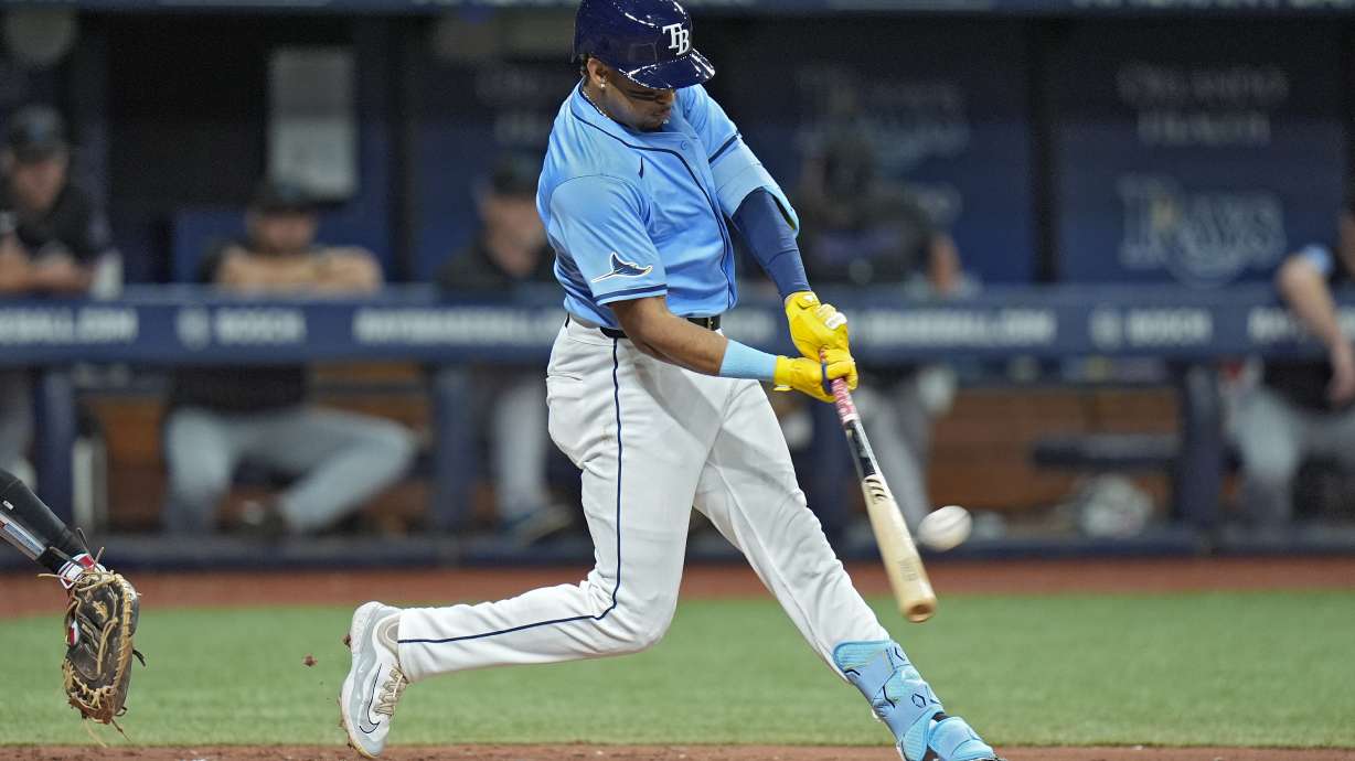 Tampa Bay Rays' Christopher Morel connects for a solo home run off Miami Marlins starting pitcher Edward Cabrera during the fourth inning of a baseball game Tuesday, July 30, 2024, in St. Petersburg, Fla.